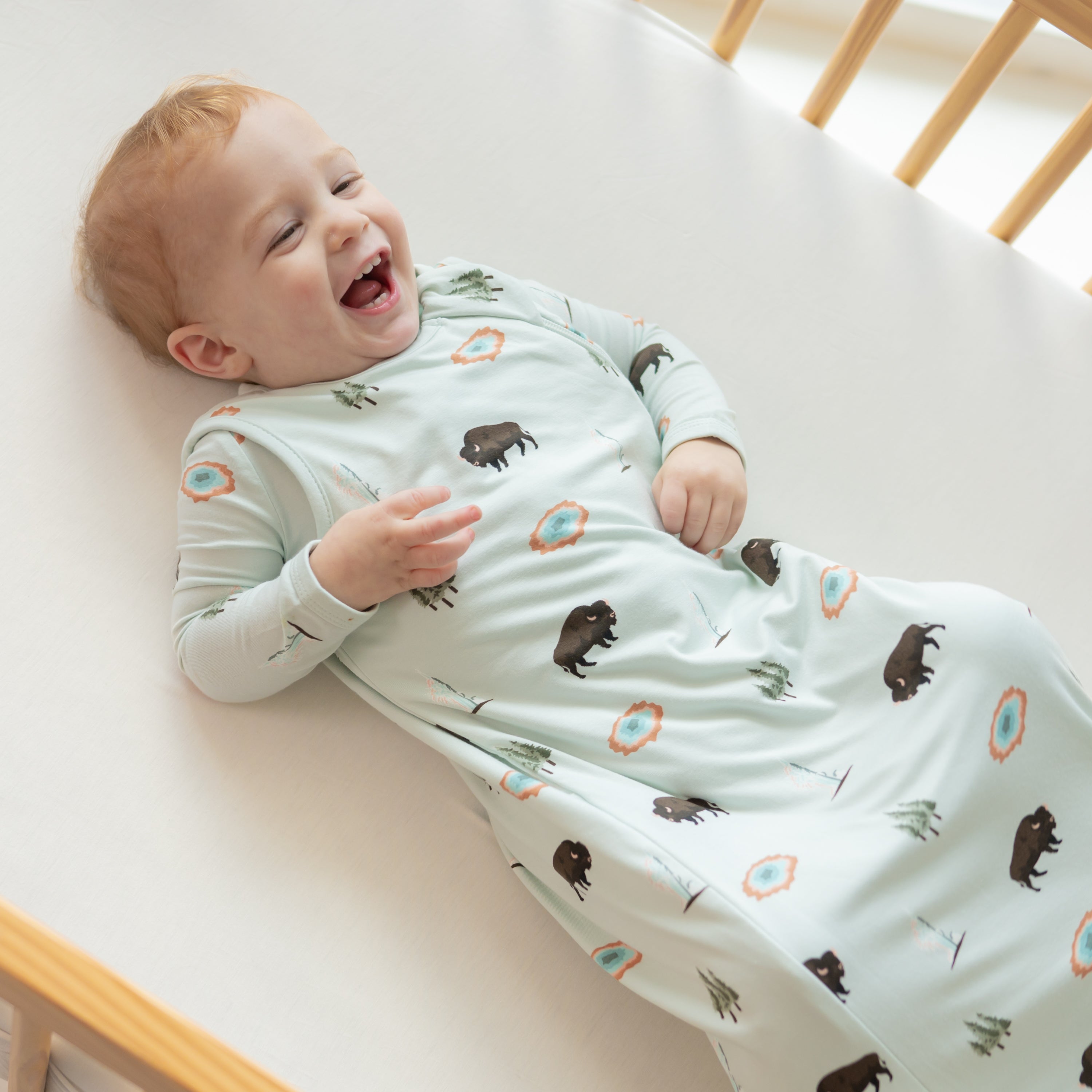 Young toddler wearing Sleep Bag in Yellowstone 0.5 in a crib