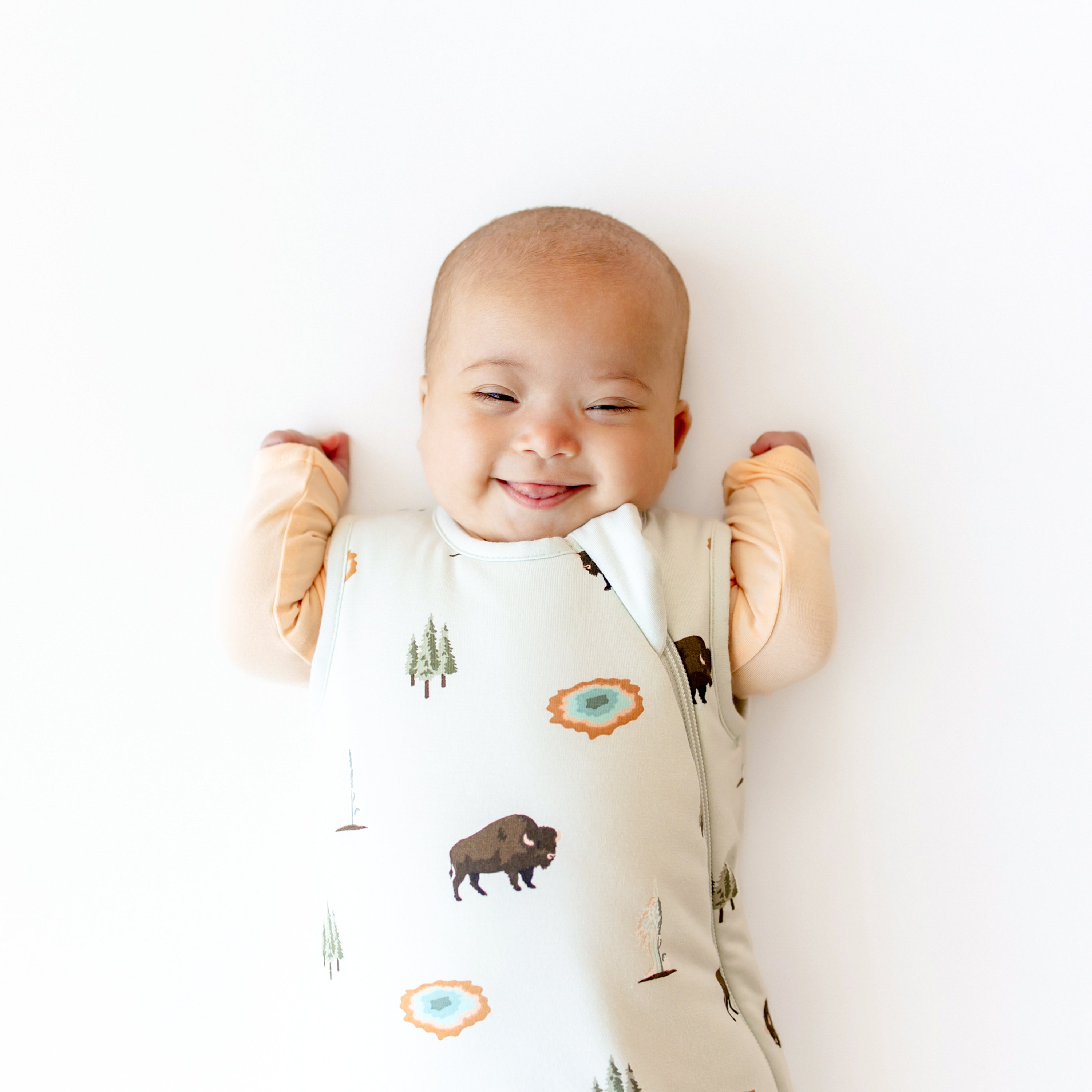Close up of Baby modeling Sleep Bag in Yellowstone 1.0 and Canyon Footie