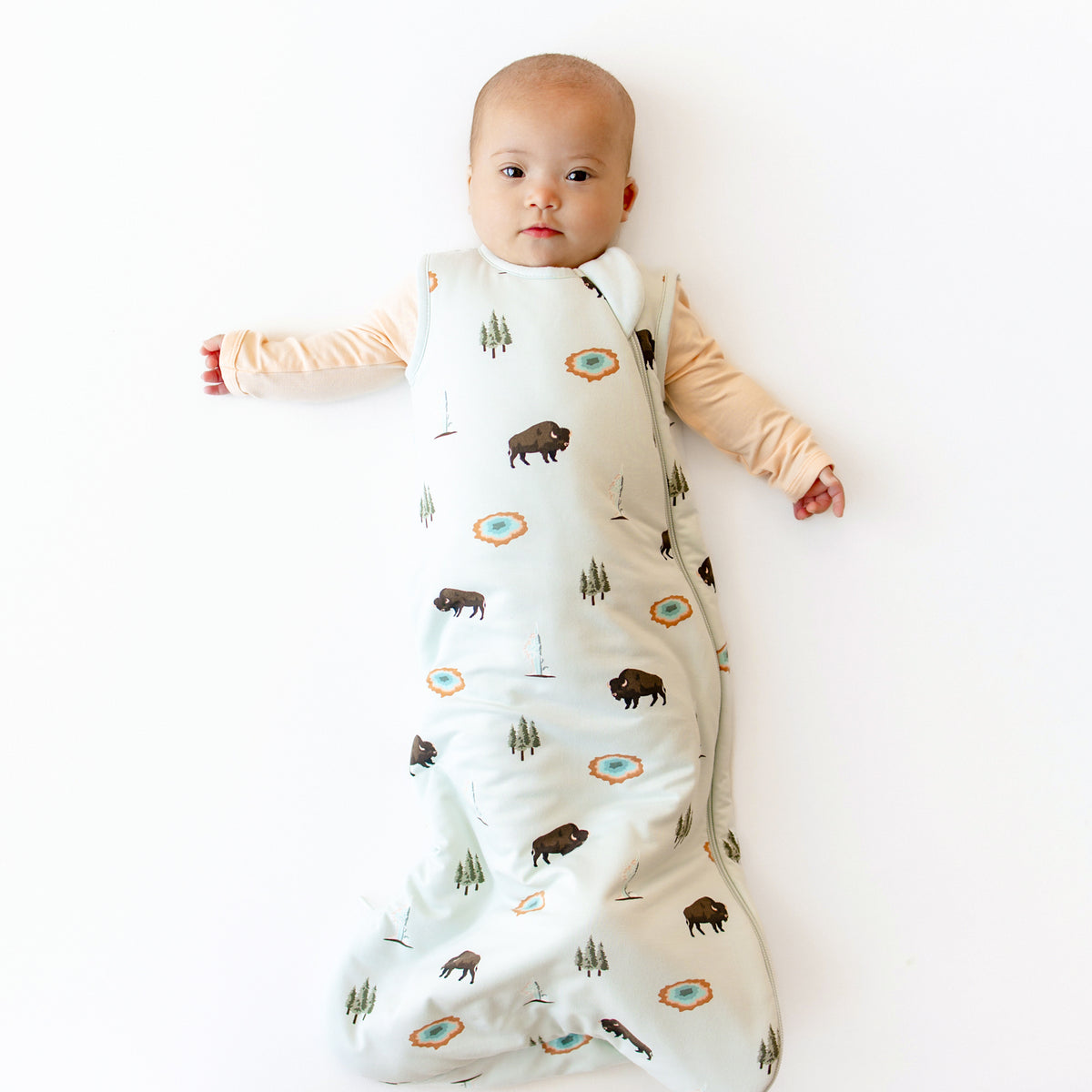 Baby modeling Sleep Bag in Yellowstone 1.0 and Canyon Footie