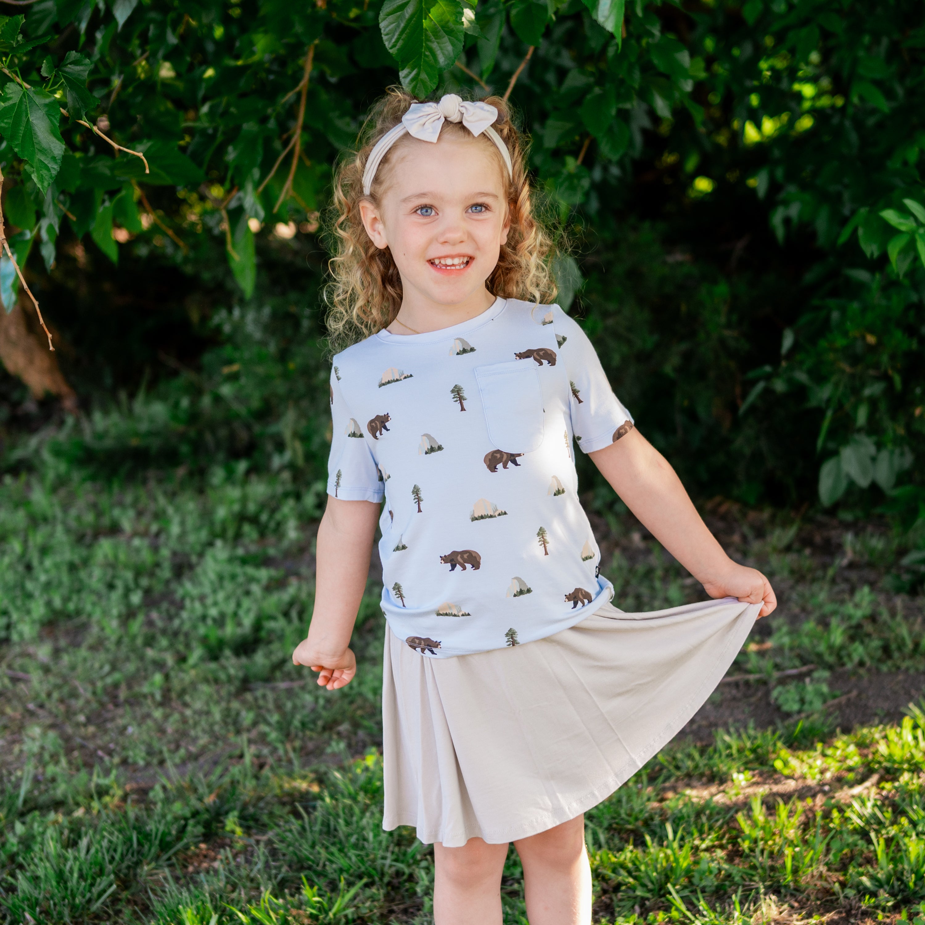 Toddler modeling Toddler Crew Neck Tee in Yosemite with an Oat Skort outdoors