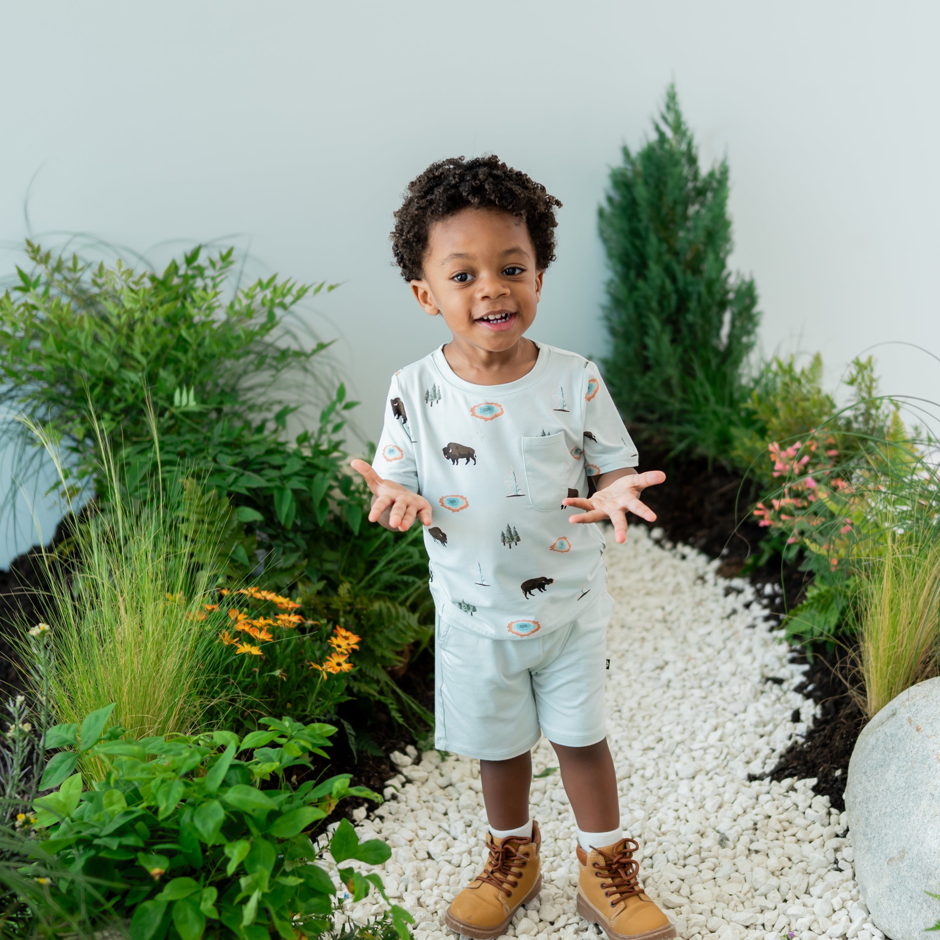 Toddler modeling Toddler Crew Neck Tee in Yellowstone on nature trail backdrop