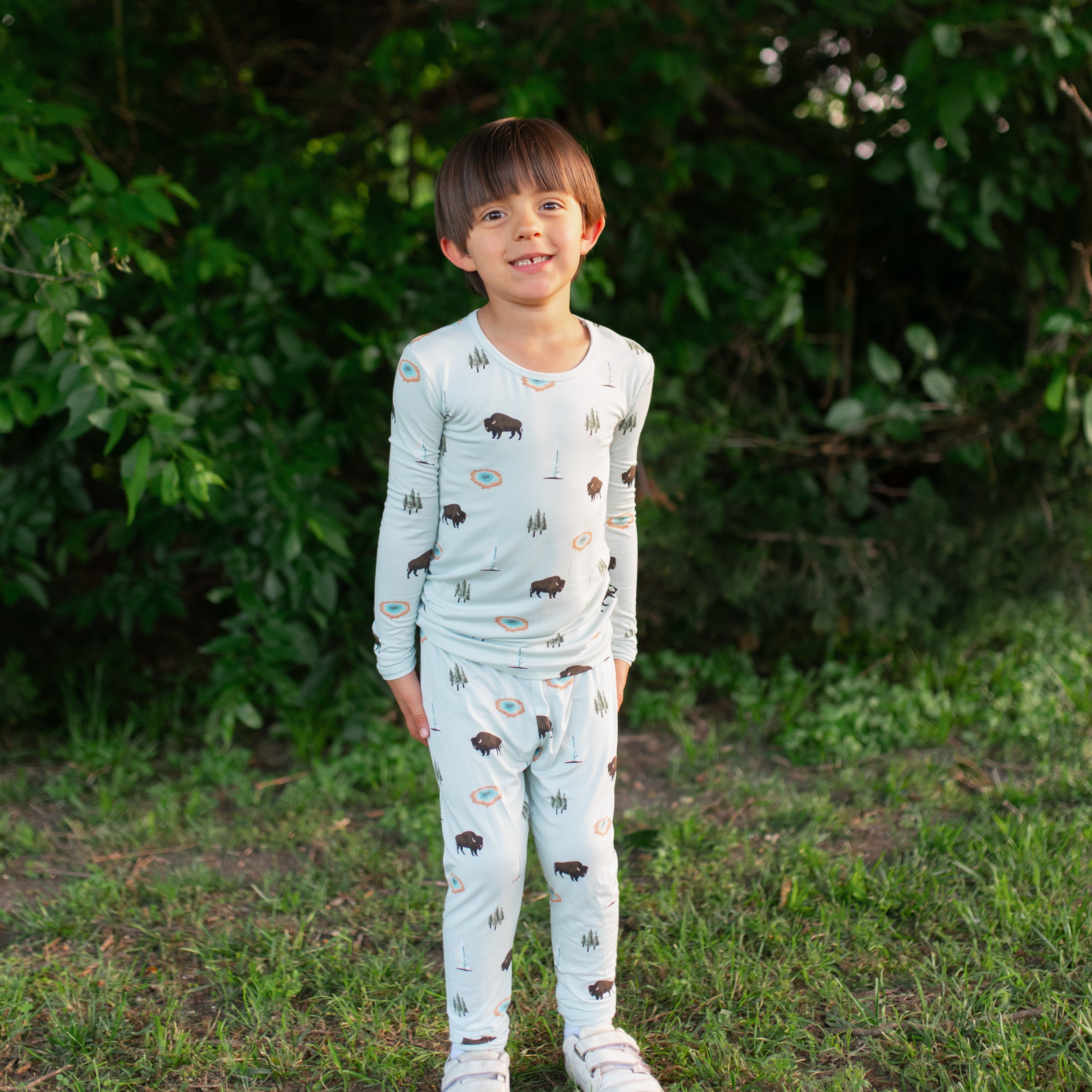 Toddler modeling Long Sleeve Pajamas in Yellowstone outdoors