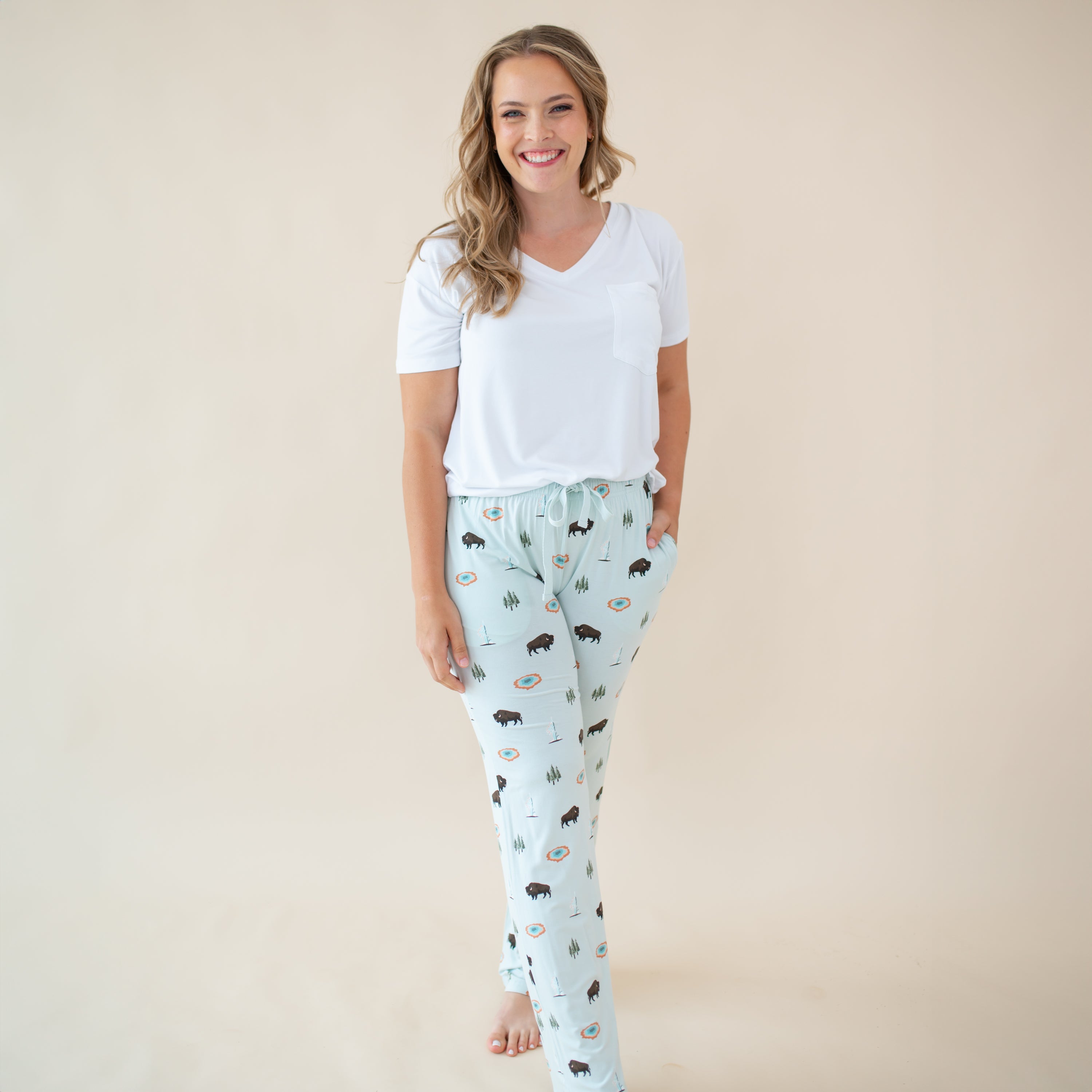 Woman modeling Women's Lounge Pants in Yellowstone and Snow V-neck tee