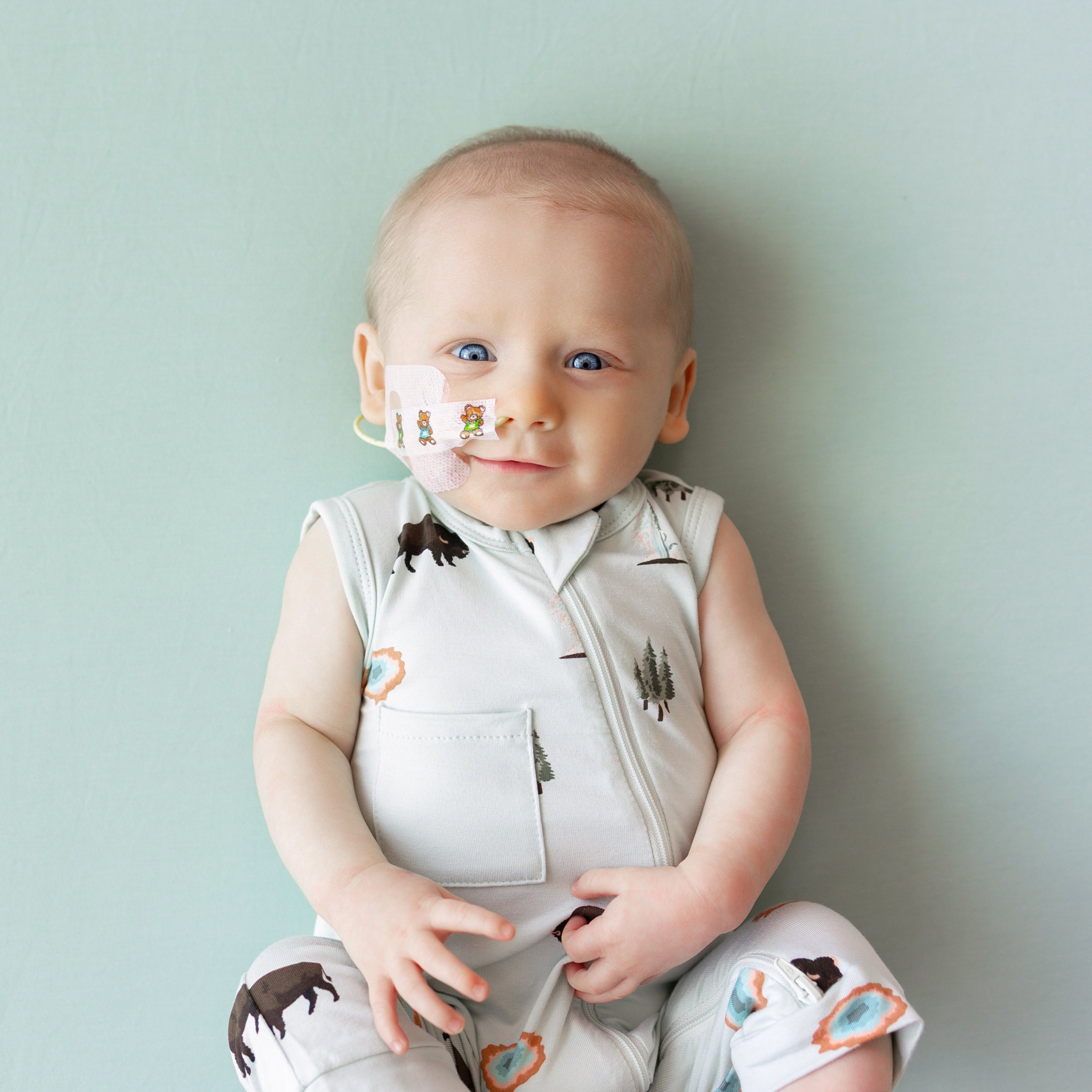Close up of Baby modeling Zippered Sleeveless Romper in Yellowstone