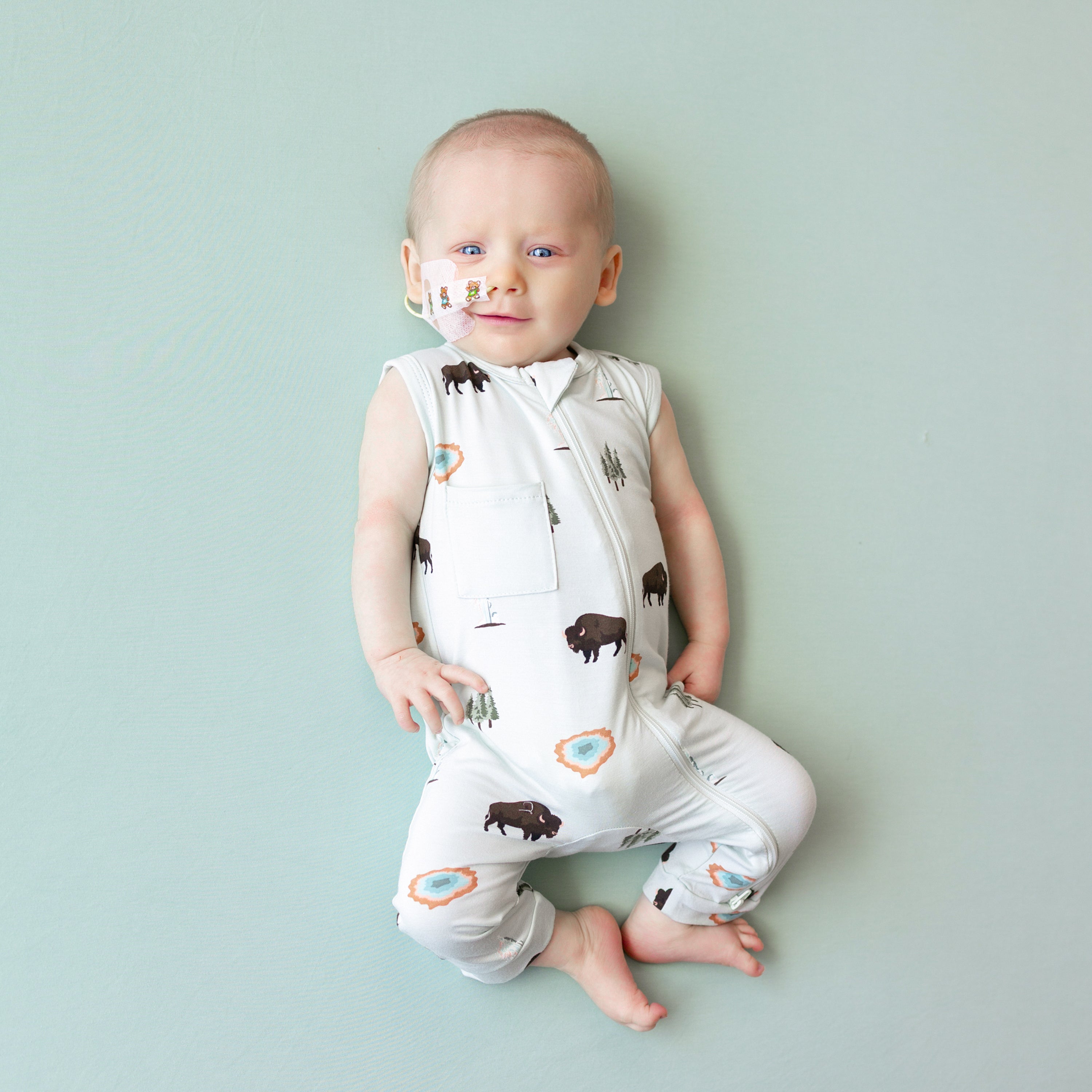 Baby modeling Zippered Sleeveless Romper in Yellowstone