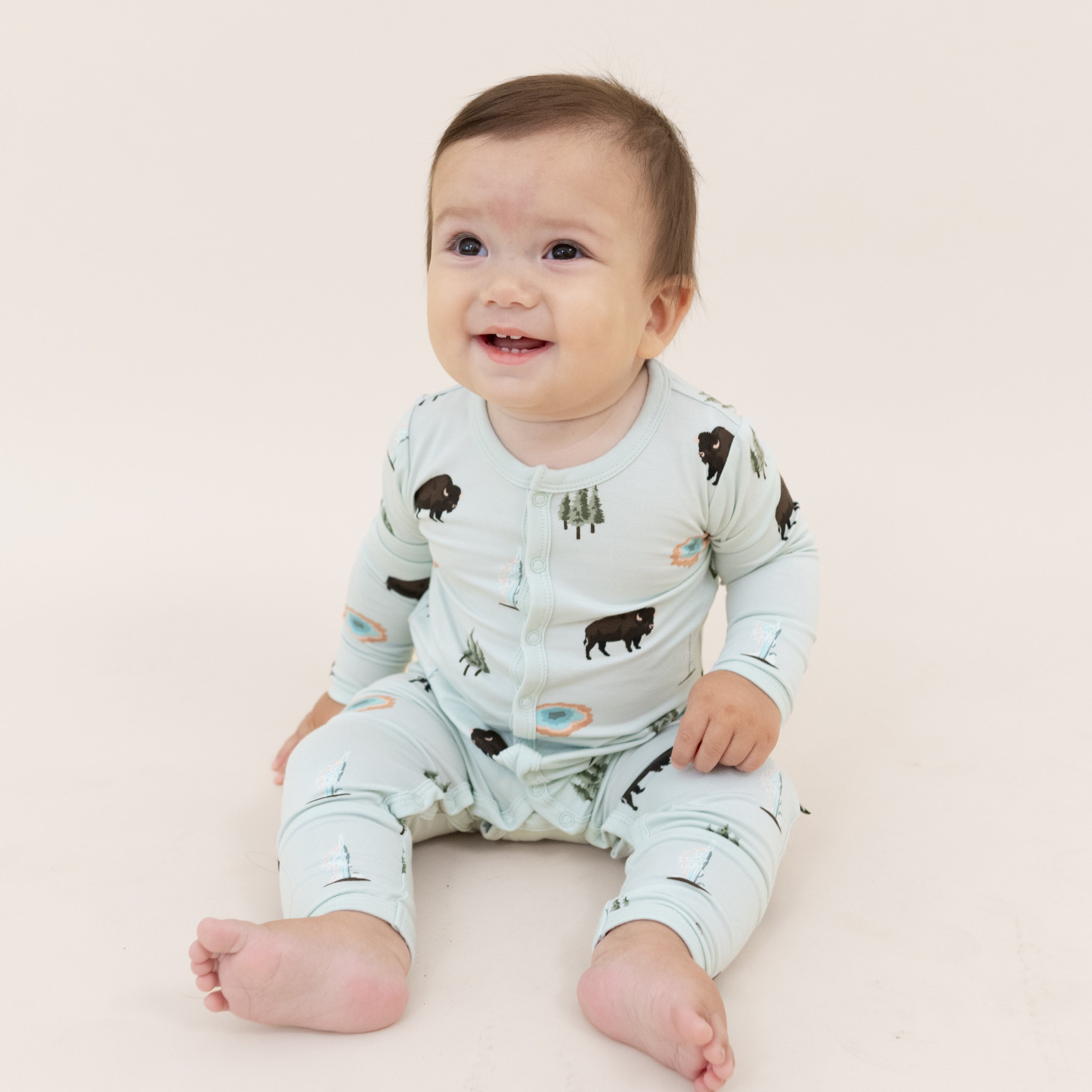 Baby wearing snap Romper pajamas in Yellowstone