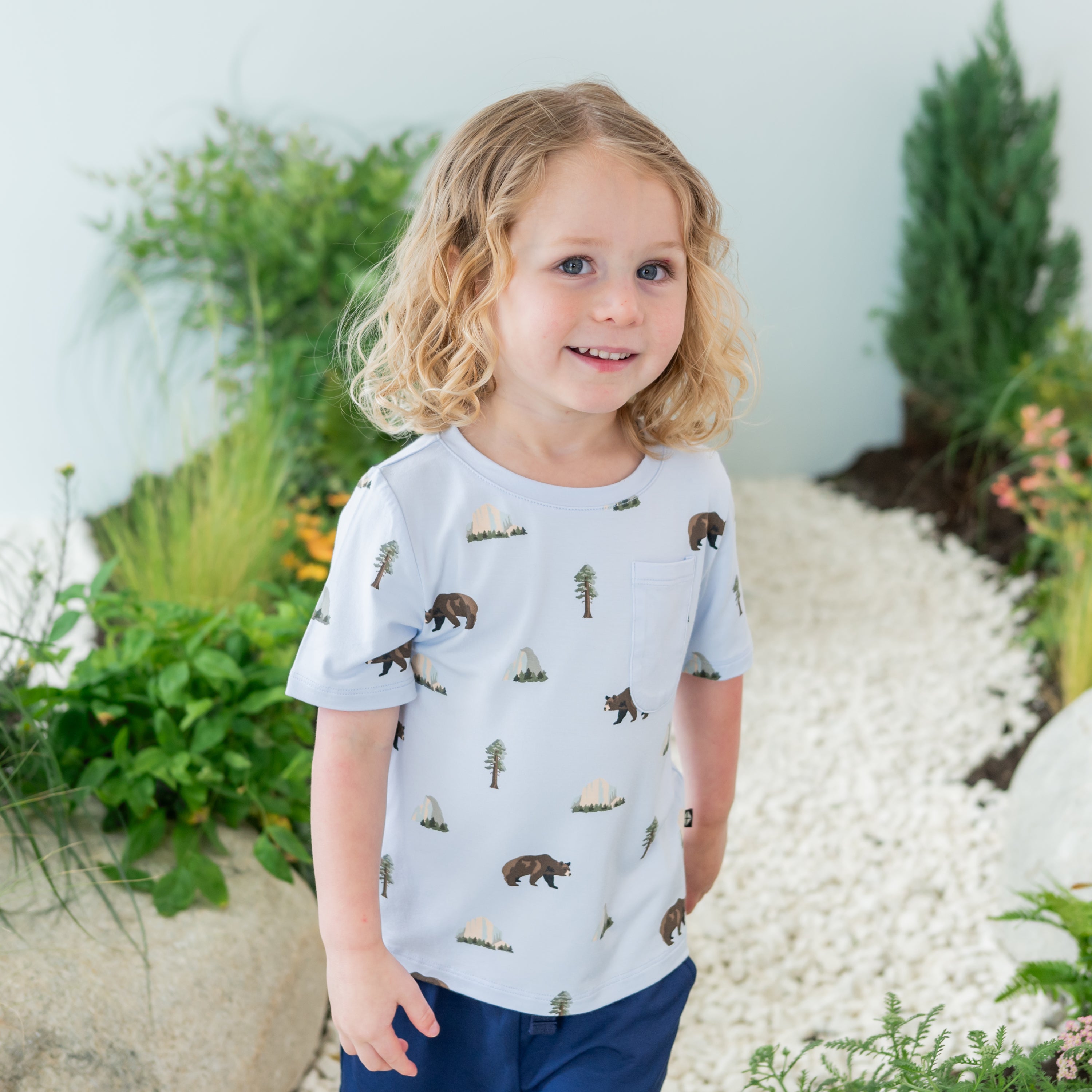 Close up of Toddler modeling Toddler Crew Neck Tee in Yosemite on a nature trail backdrop