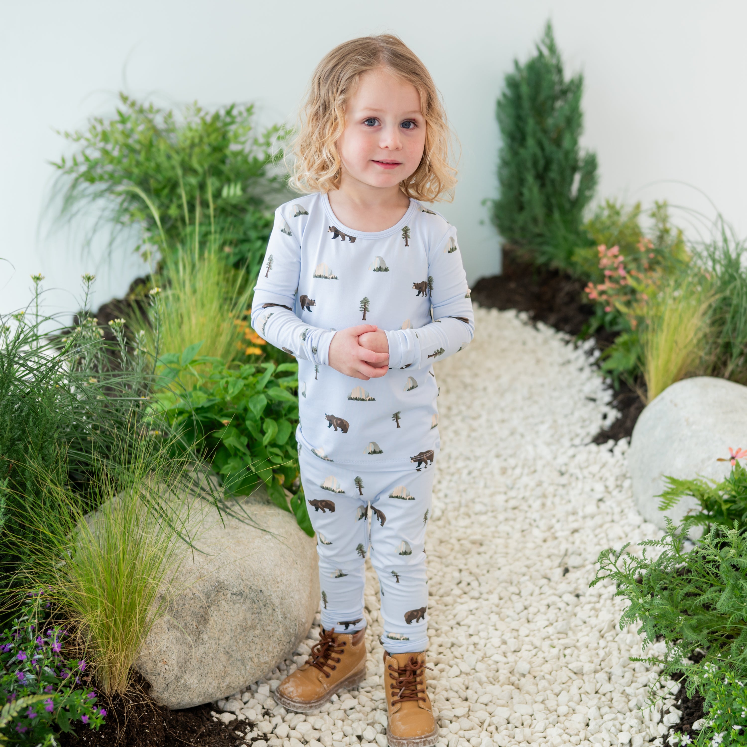 Toddler modeling Long Sleeve Pajamas in Yosemite on a nature path backdrop