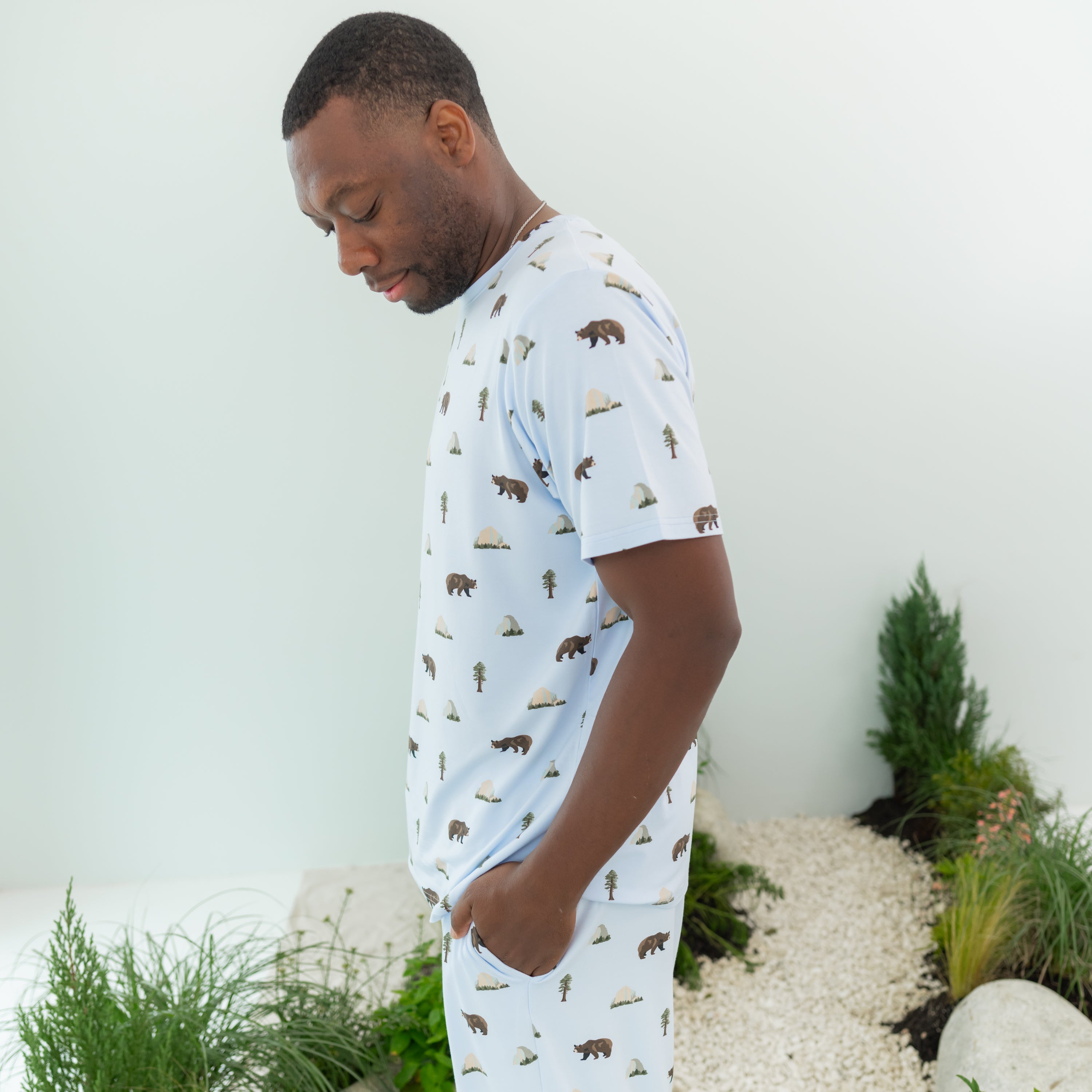 Man wearing Men's Crew Neck Tee in Yosemite showing side profile