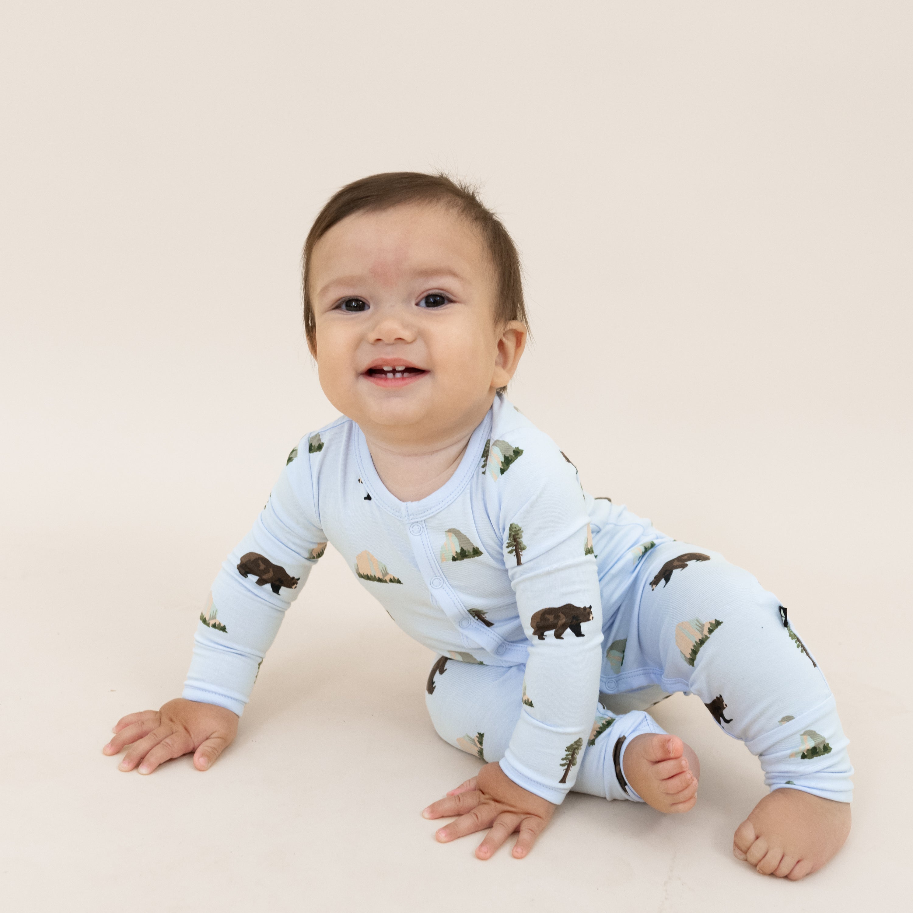 Baby wearing snap Romper pajamas in Yosemite National Park print