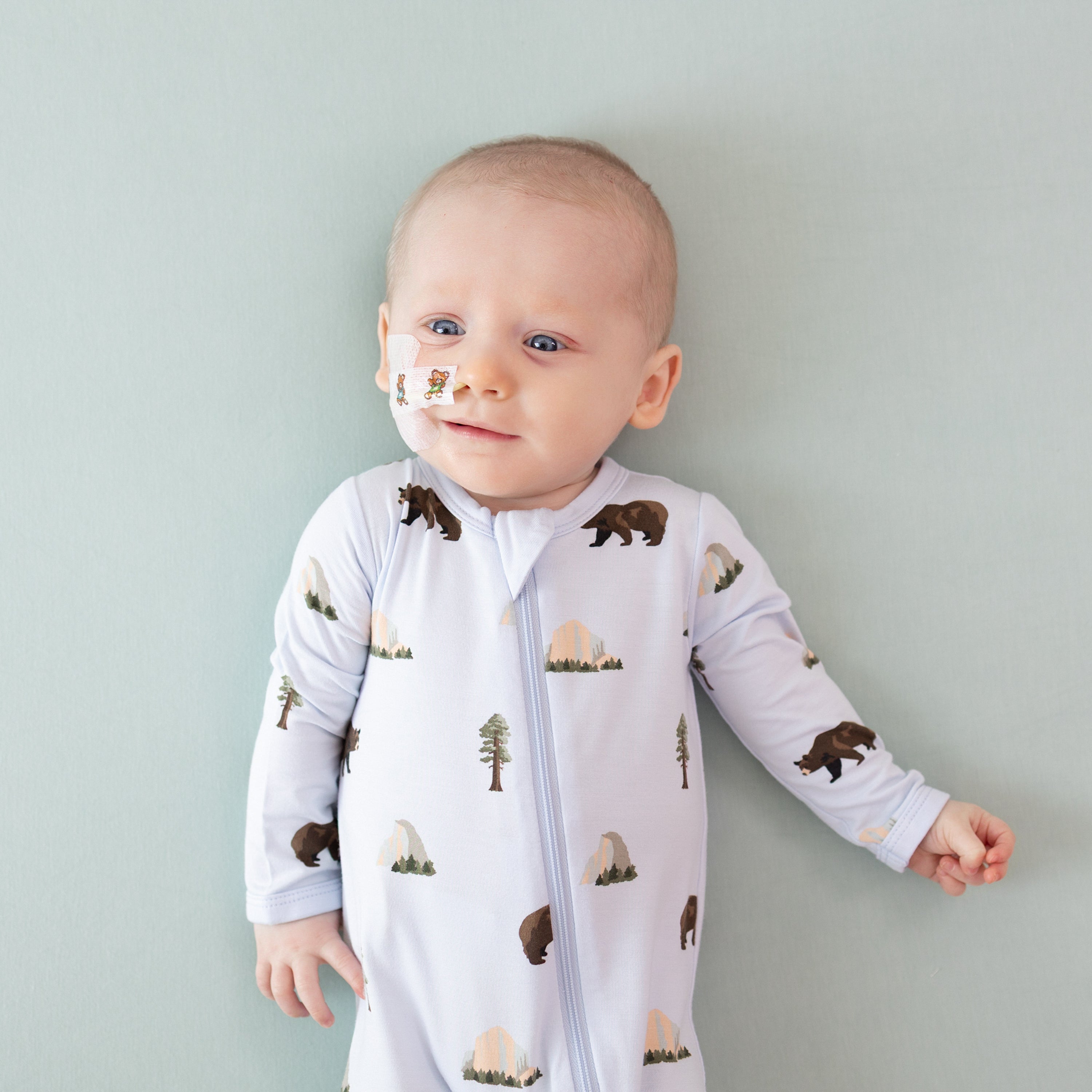 Baby wearing National Parks Zippered Footie in Yosemite