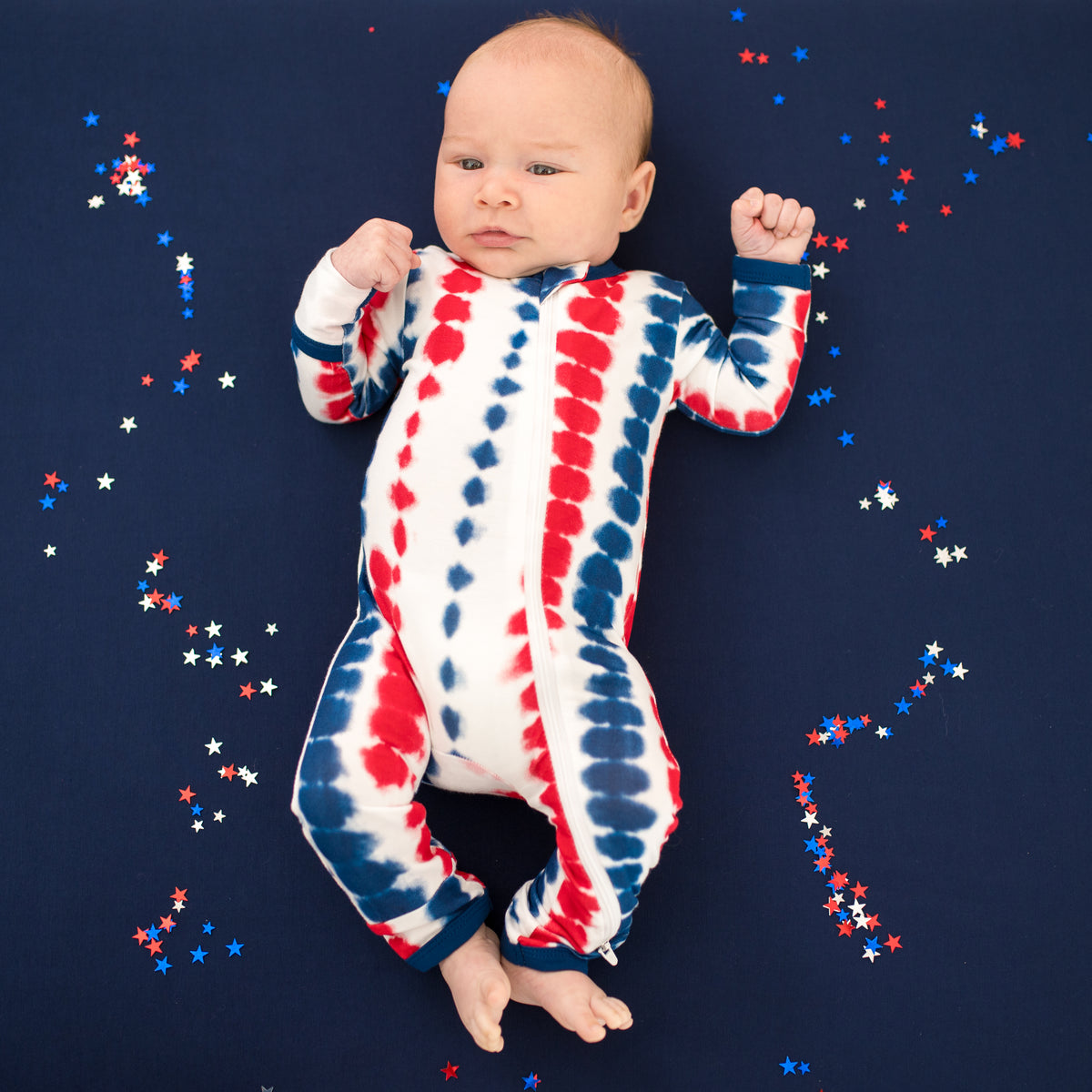 Baby wearing Zippered Romper in Liberty Rip Tide