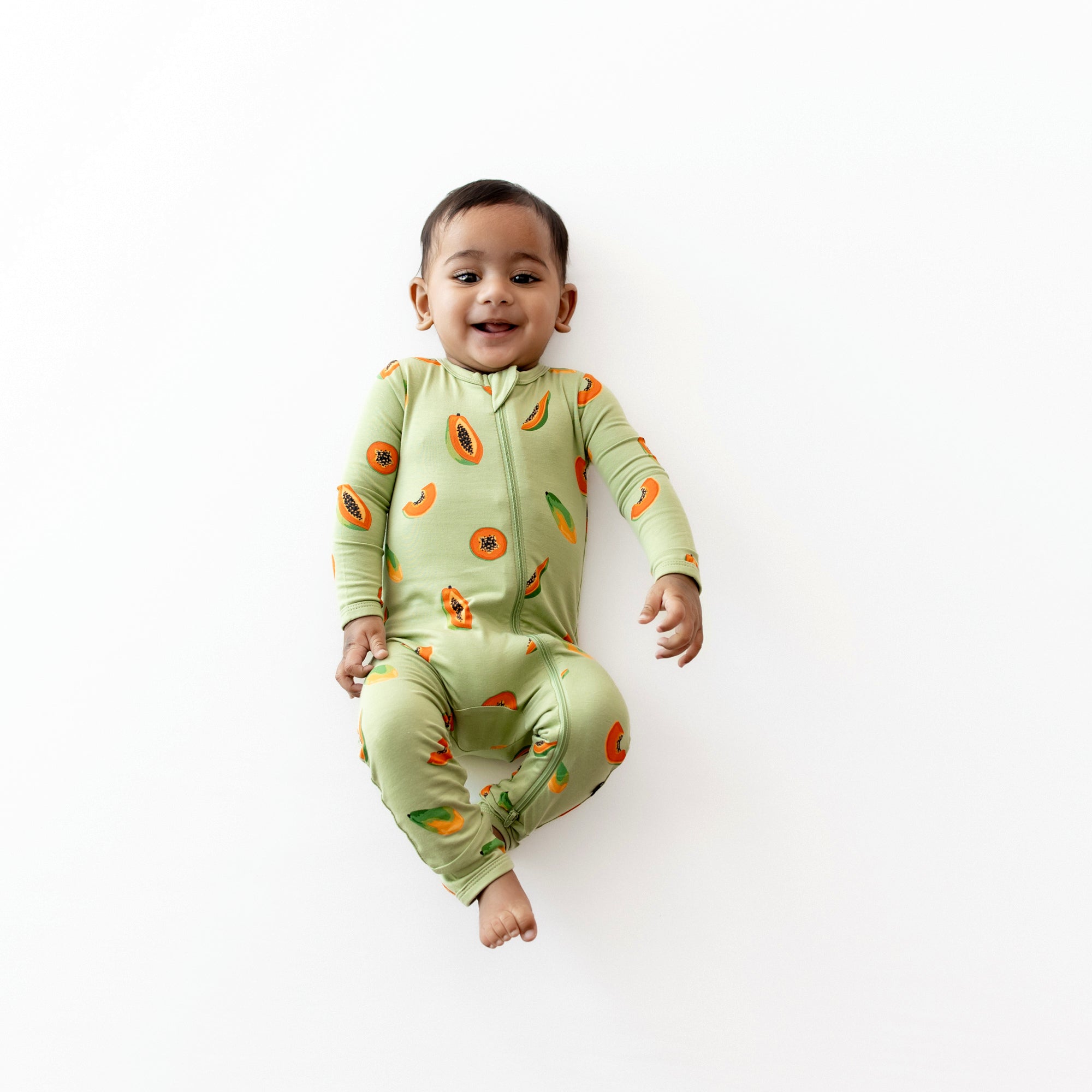 Baby modeling Zippered Romper in Papaya