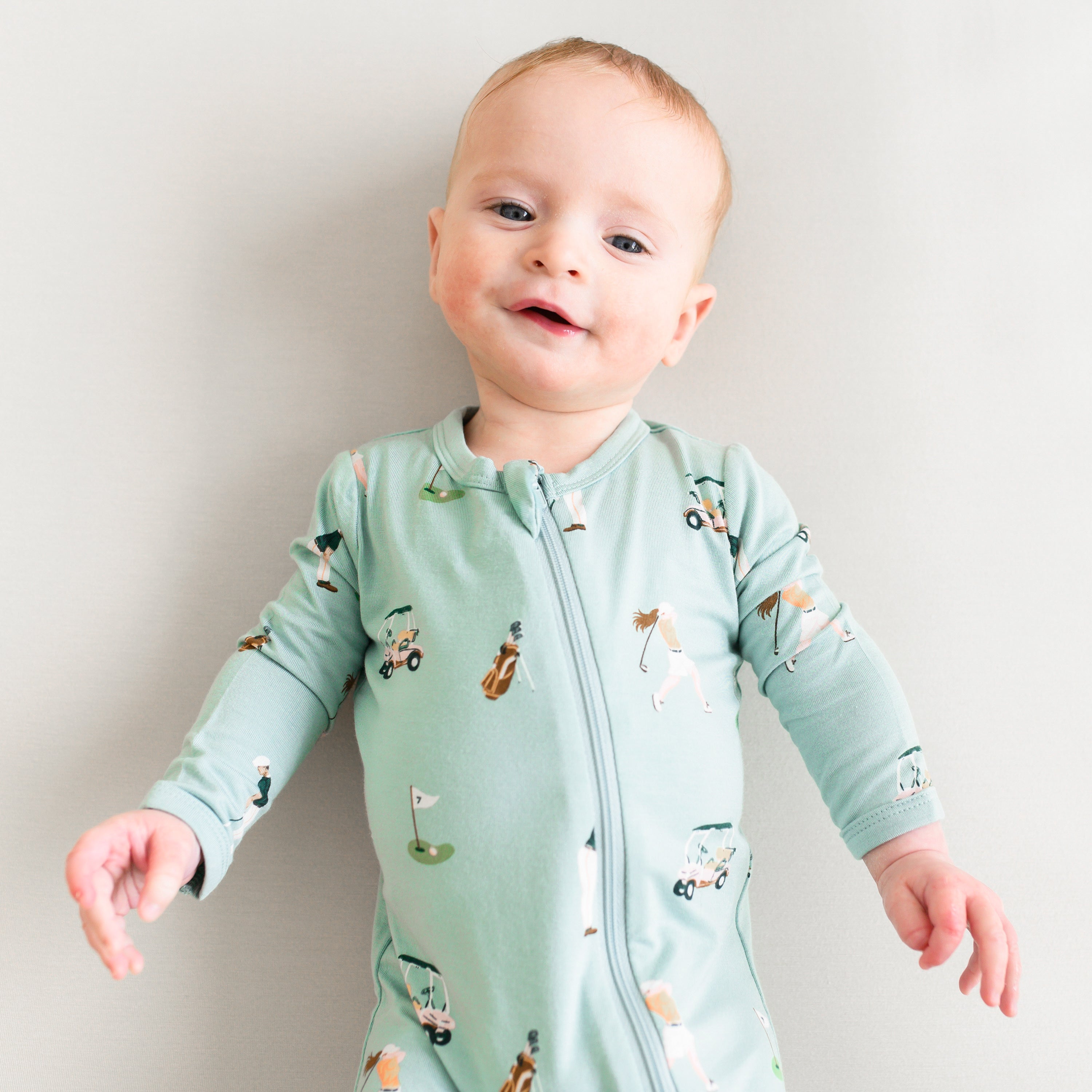 Infant in Zippered Footie bamboo pajamas in Golf