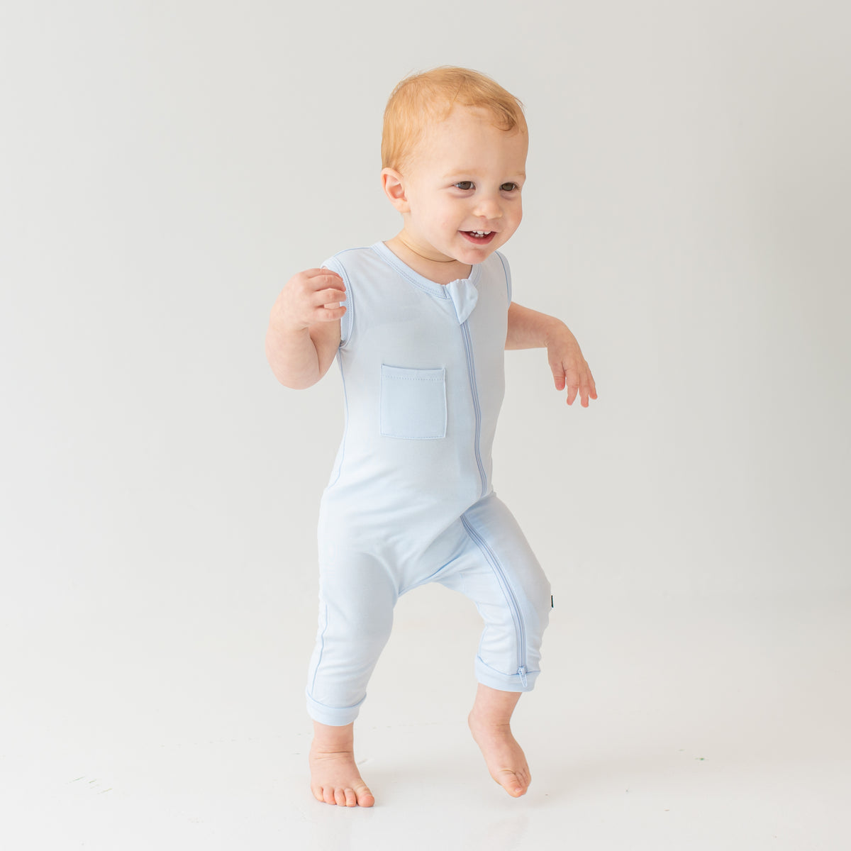 Young toddler modeling Zippered Sleeveless Romper in Mist