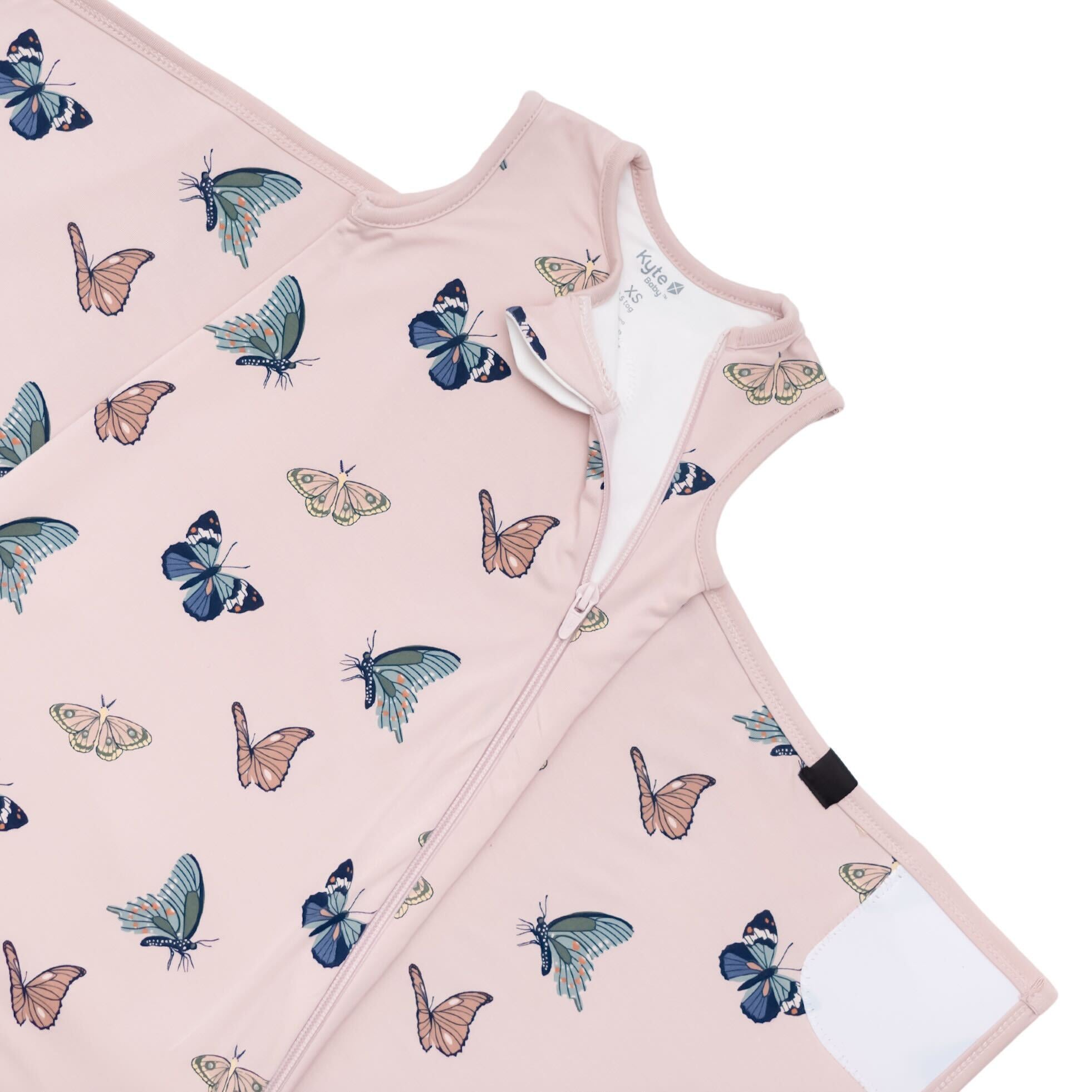 Zipper garage and top zipper of the 0.5 TOG Sleep Bag Swaddler in Blush Butterfly