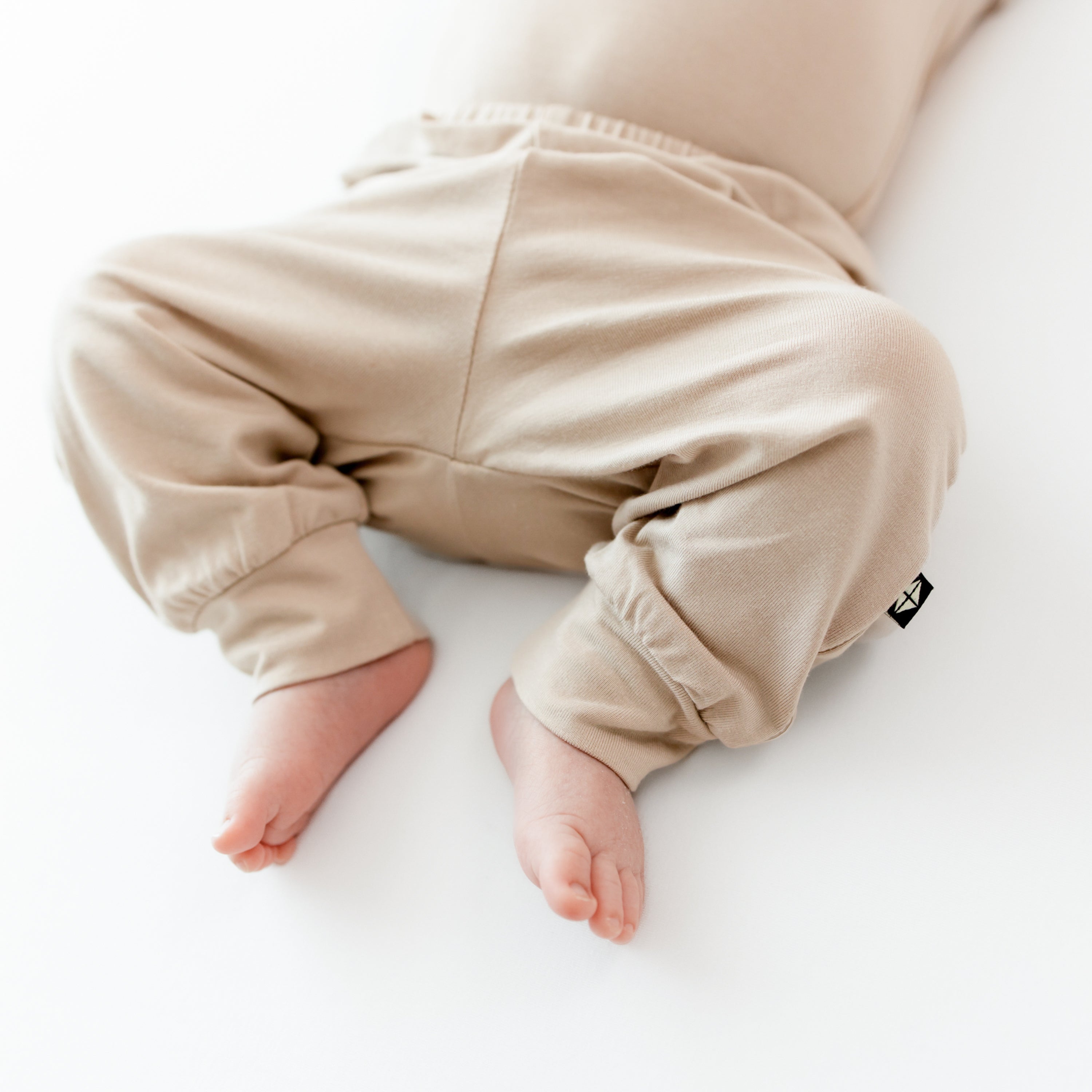 Infant wearing the Pant in Bisque