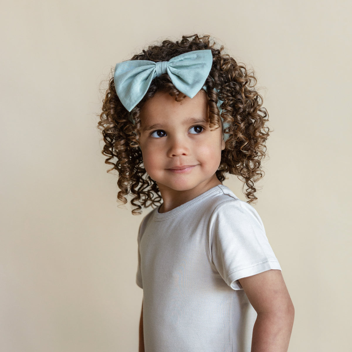 Toddler wearing Bow Headband in Sage
