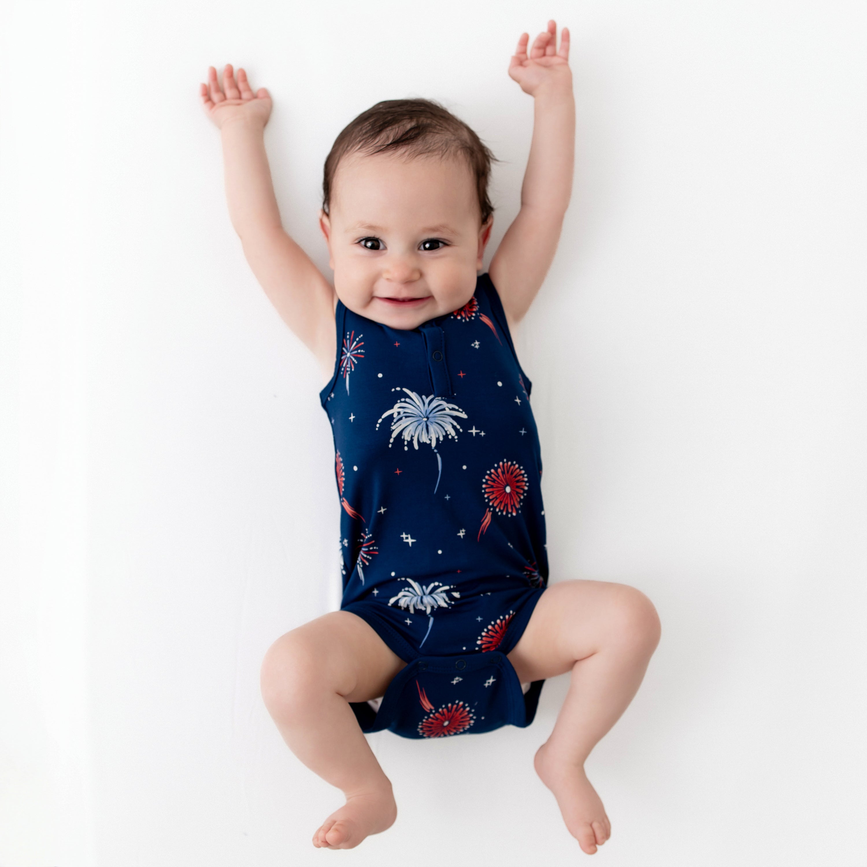 Baby modeling Sleeveless Bodysuit in Celebration with arms up
