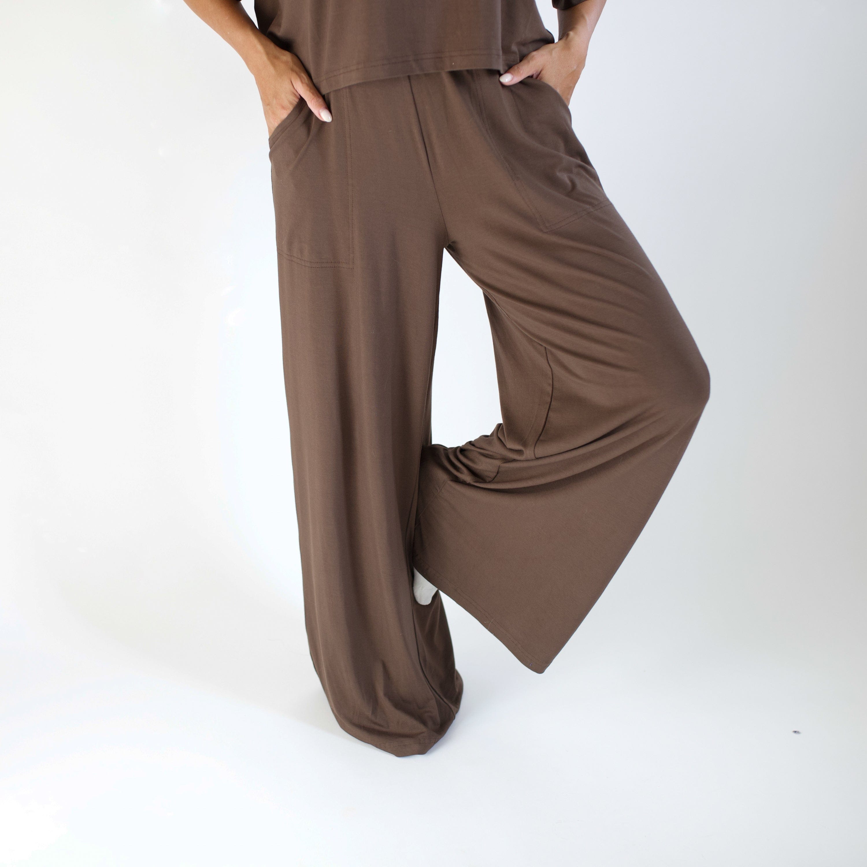 Brown outfit with wide-leg pants on a white background