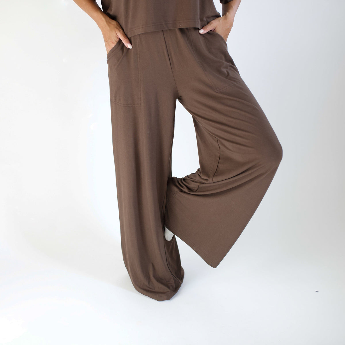 Brown outfit with wide-leg pants on a white background