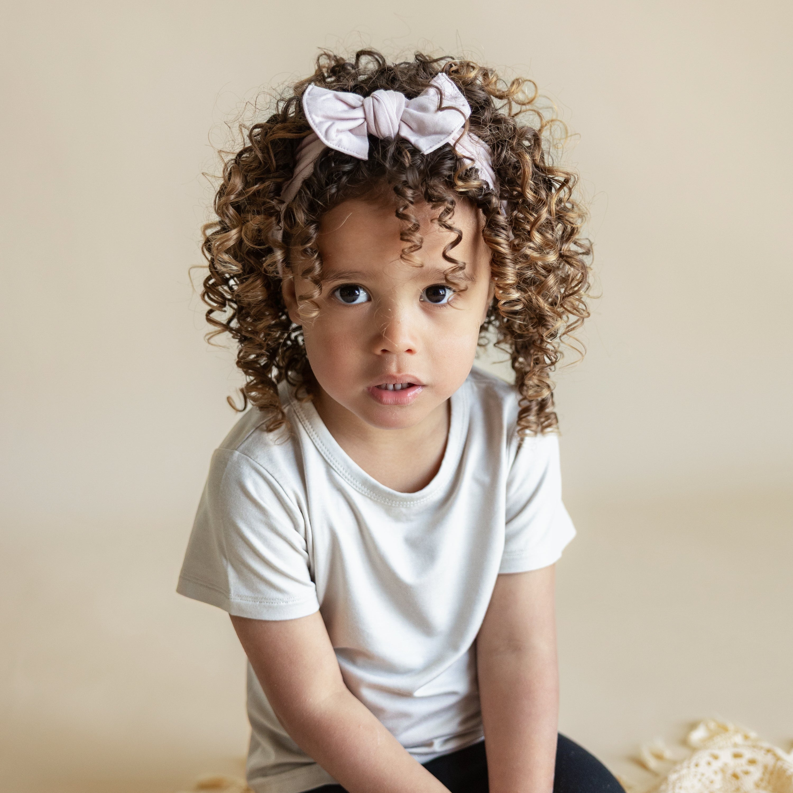 Toddler modeling Knotted Bow Headband in Blush