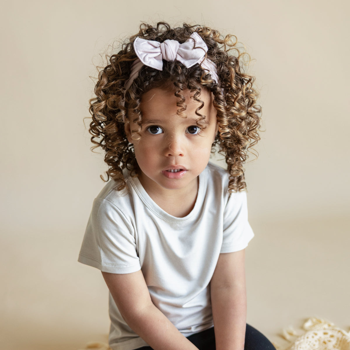 Toddler modeling Knotted Bow Headband in Blush
