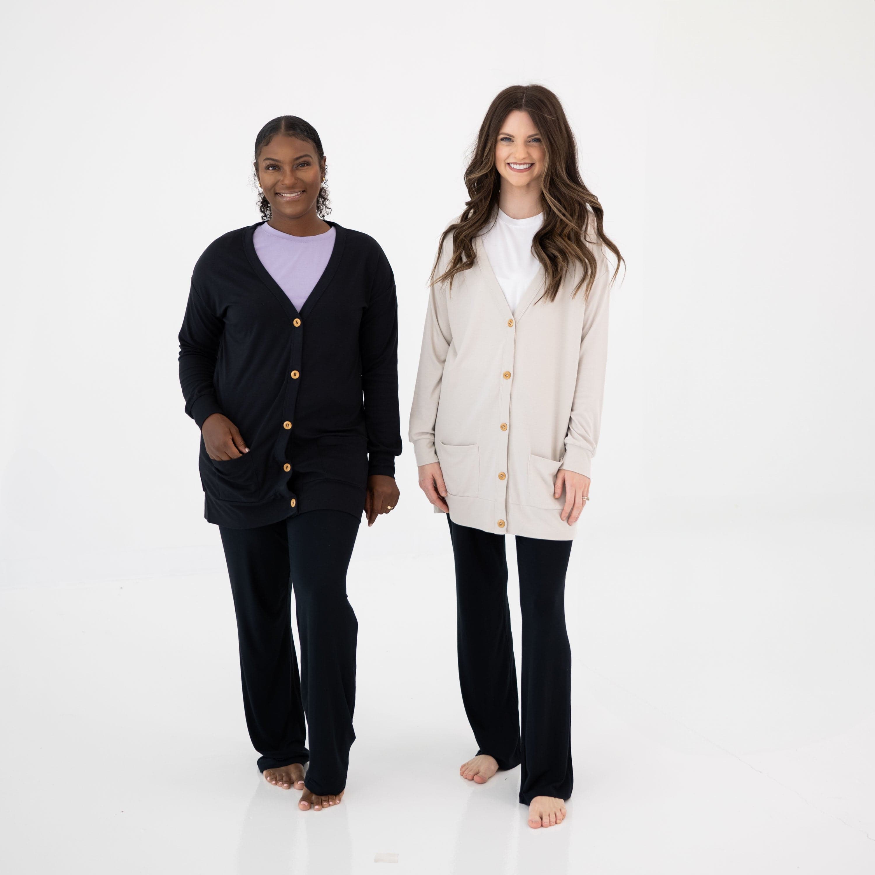 Women wearing Kyte Baby Bamboo Jersey Long Adult Cardigans in Oat and Midnight