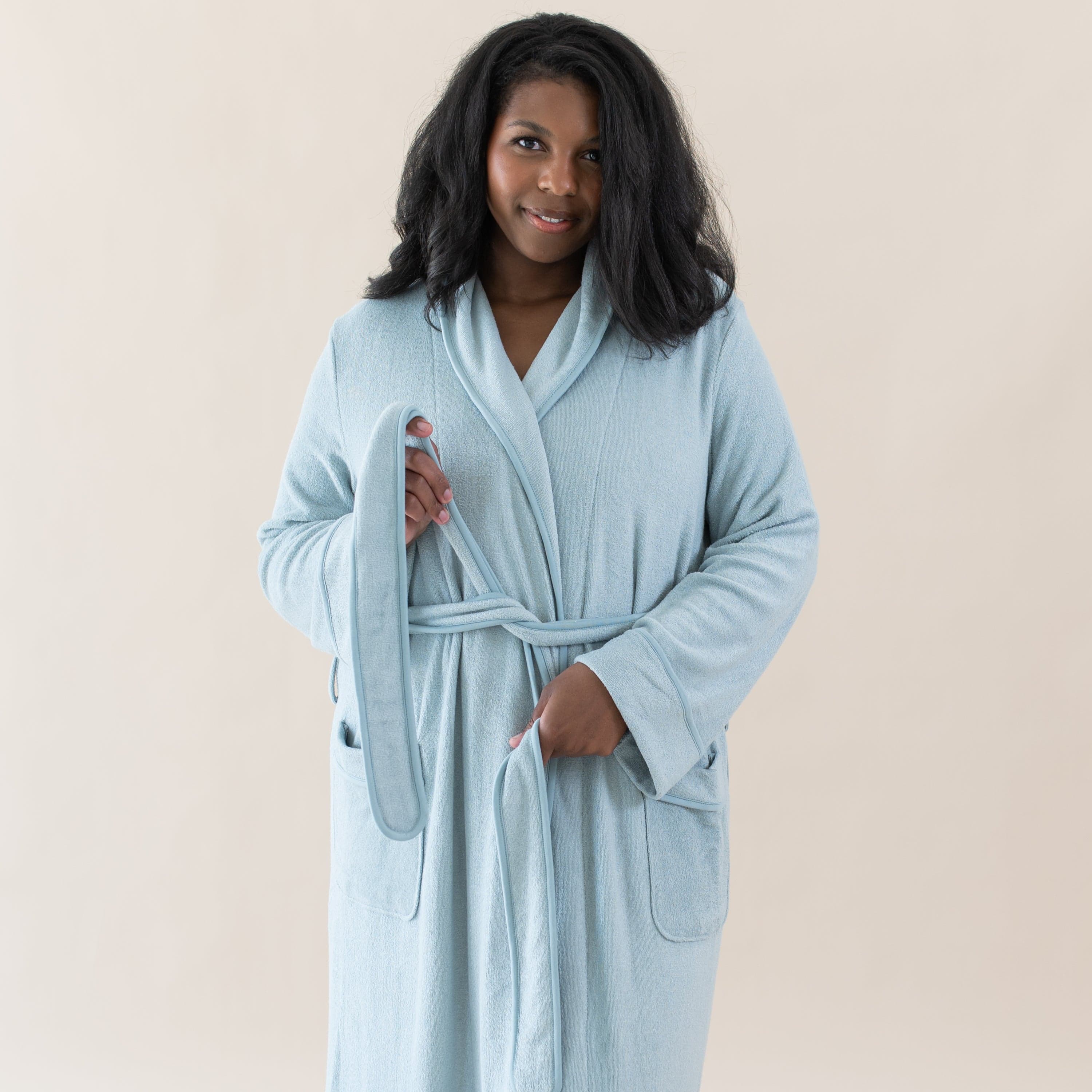 Woman wearing Kyte Baby Adult Robe with self-tie waist in Fog