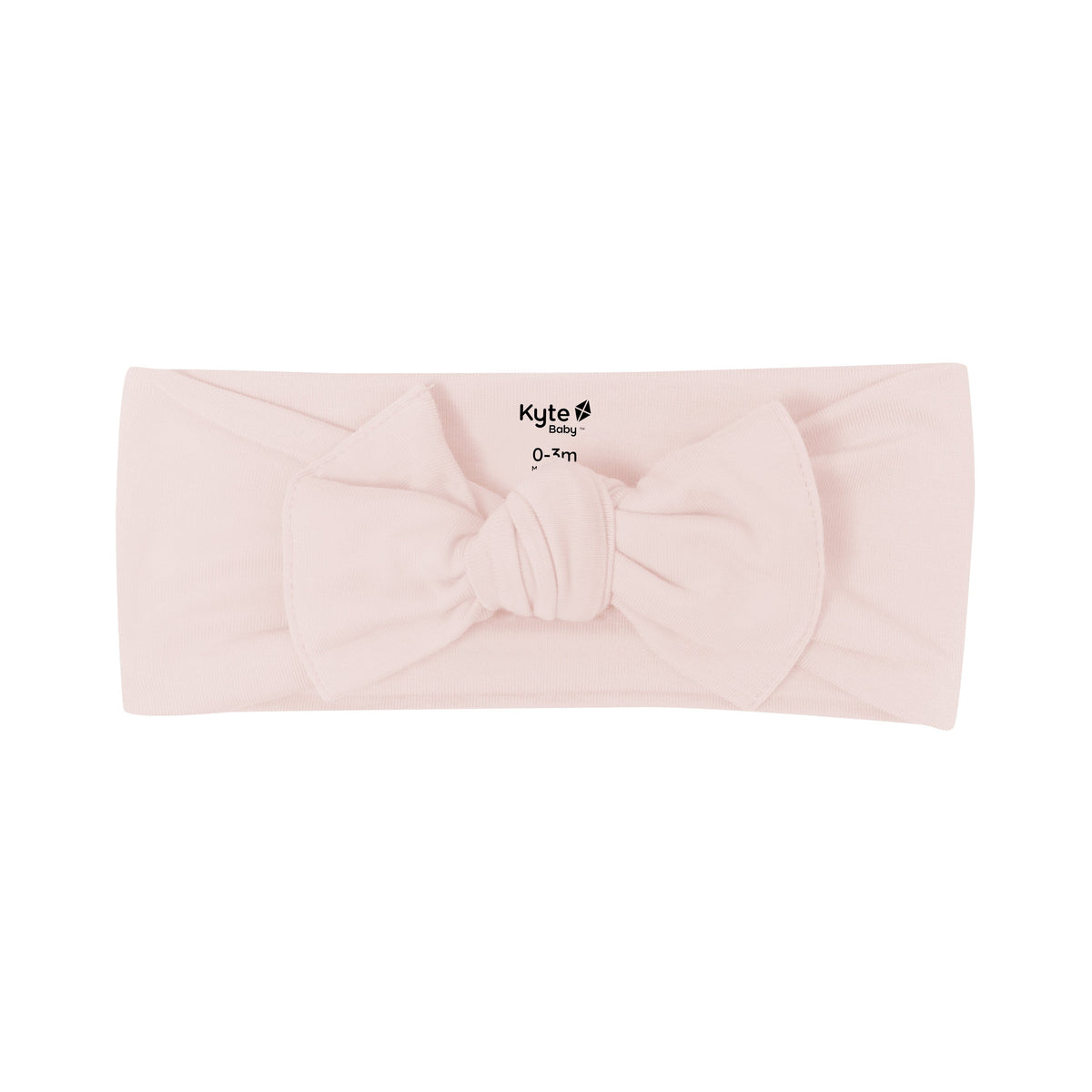 Flat lay of Kyte Baby Bow in Blush