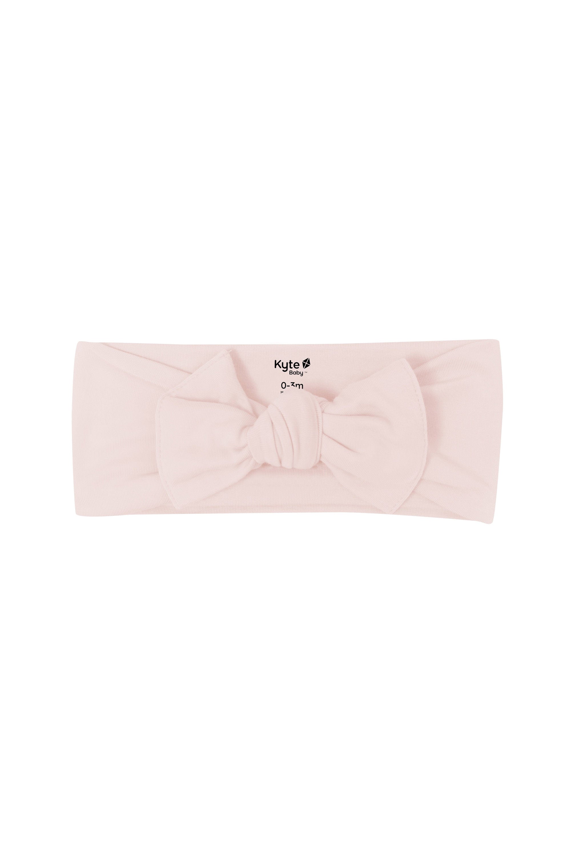 Flat lay of Kyte Baby Bow in Blush
