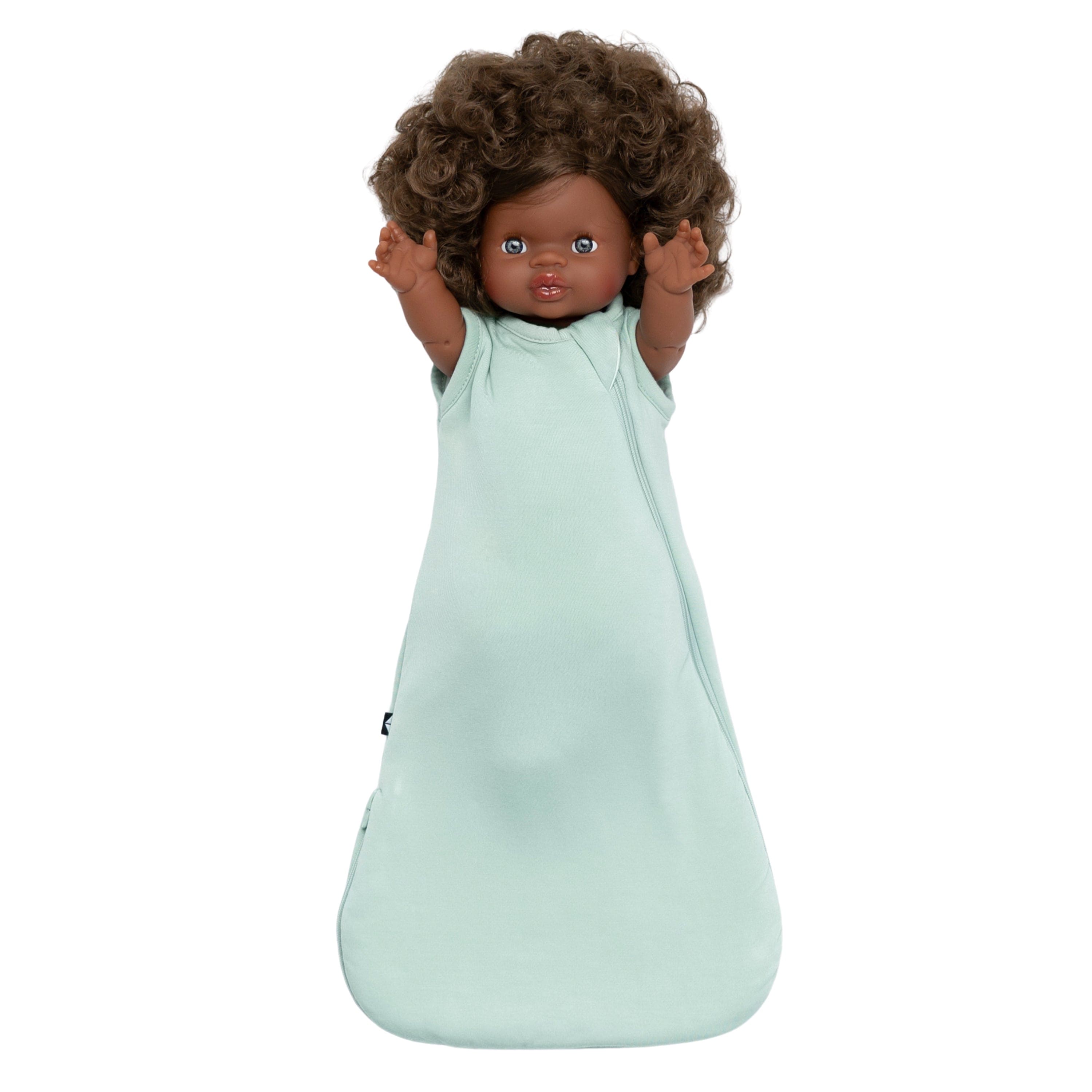 Toy wearing Kyte Baby Dolly Sleep Bag in Sage