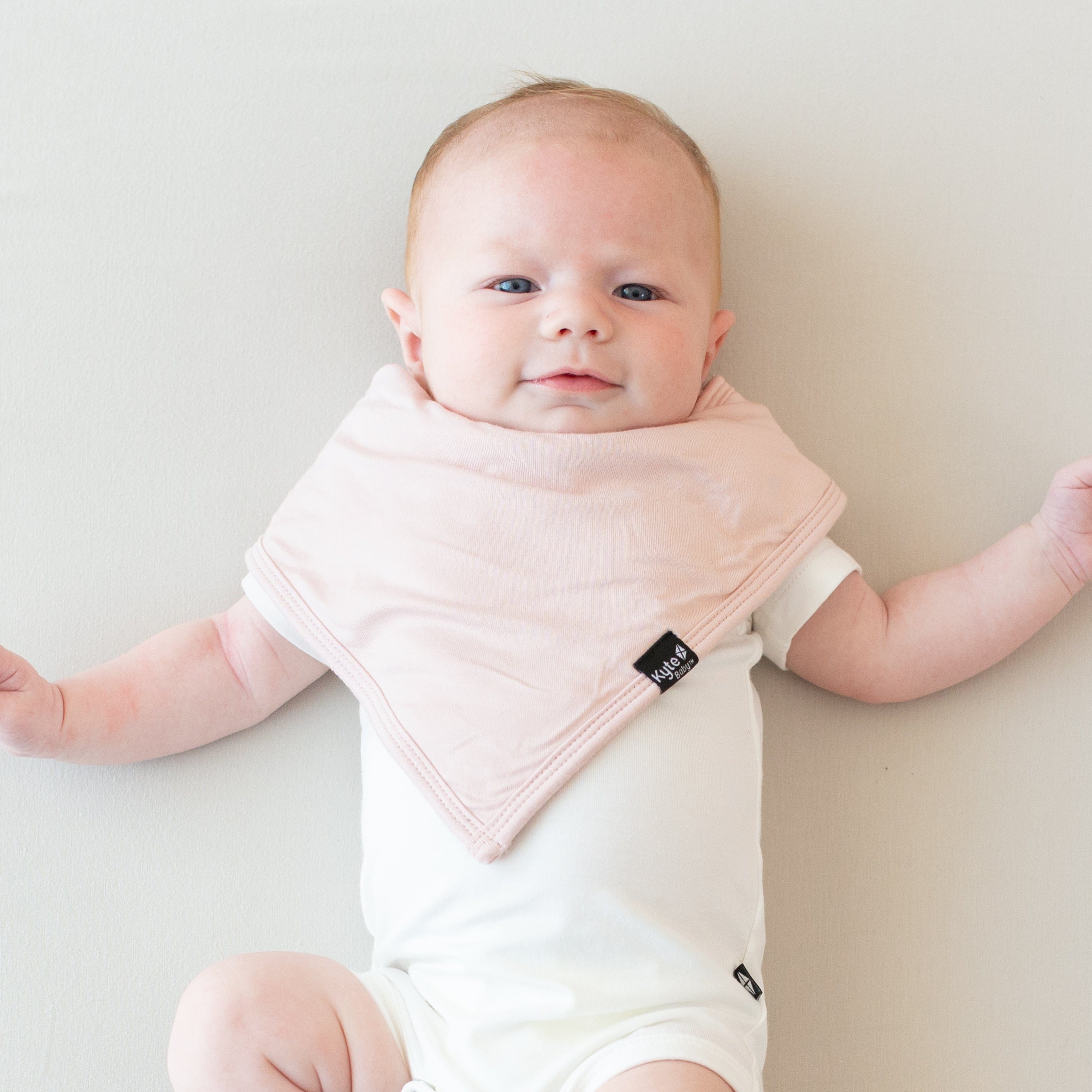 Infant wearing a Bib in Blush and Short Sleeve Bodysuit in Cloud