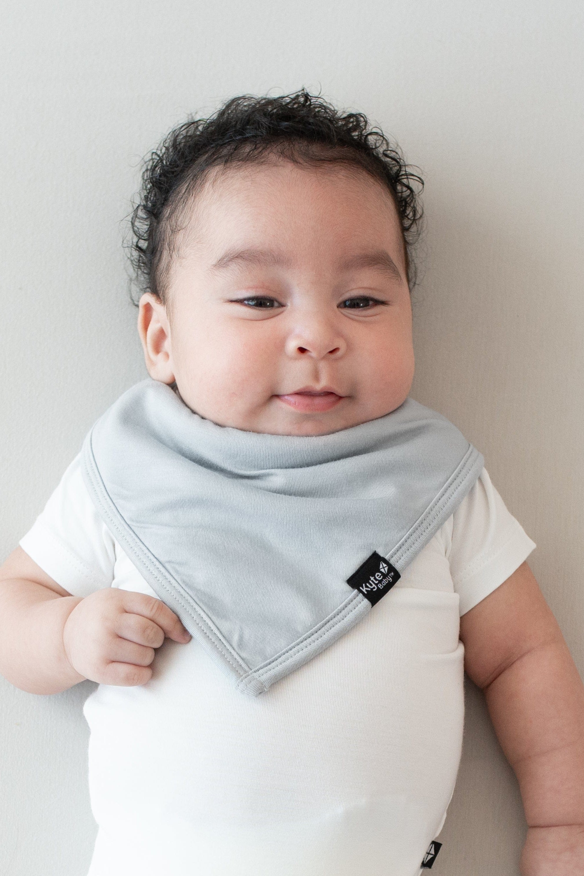 Infant modeling the Kyte Baby Bib in Storm