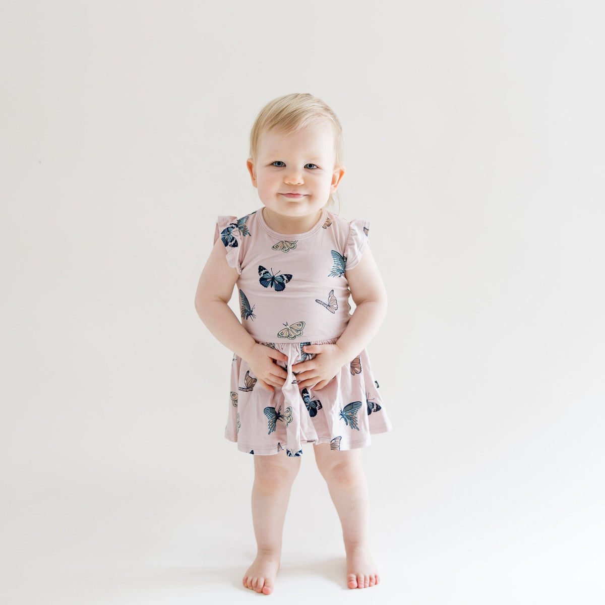 Toddler wearing Twirl Bodysuit Dress in Blush Butterfly