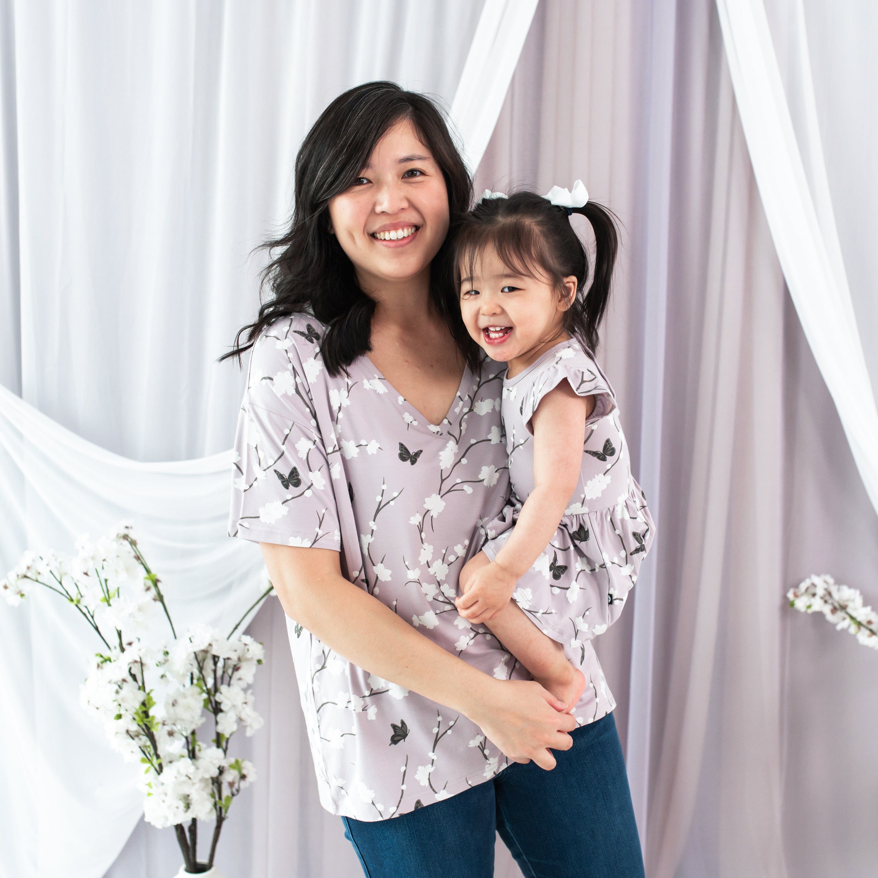 Mom and daughter wearing Kyte Baby matching mommy and me outfits in Cherry Blossom