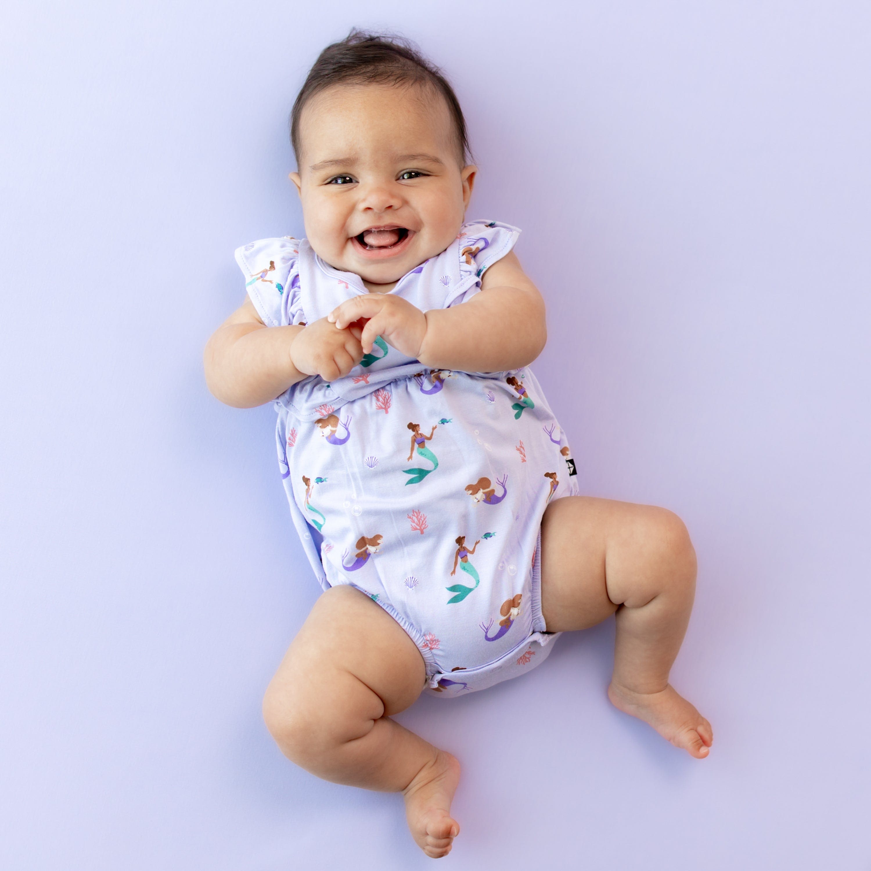 Infant wearing Kyte Baby Bubble Romper in Mermaid