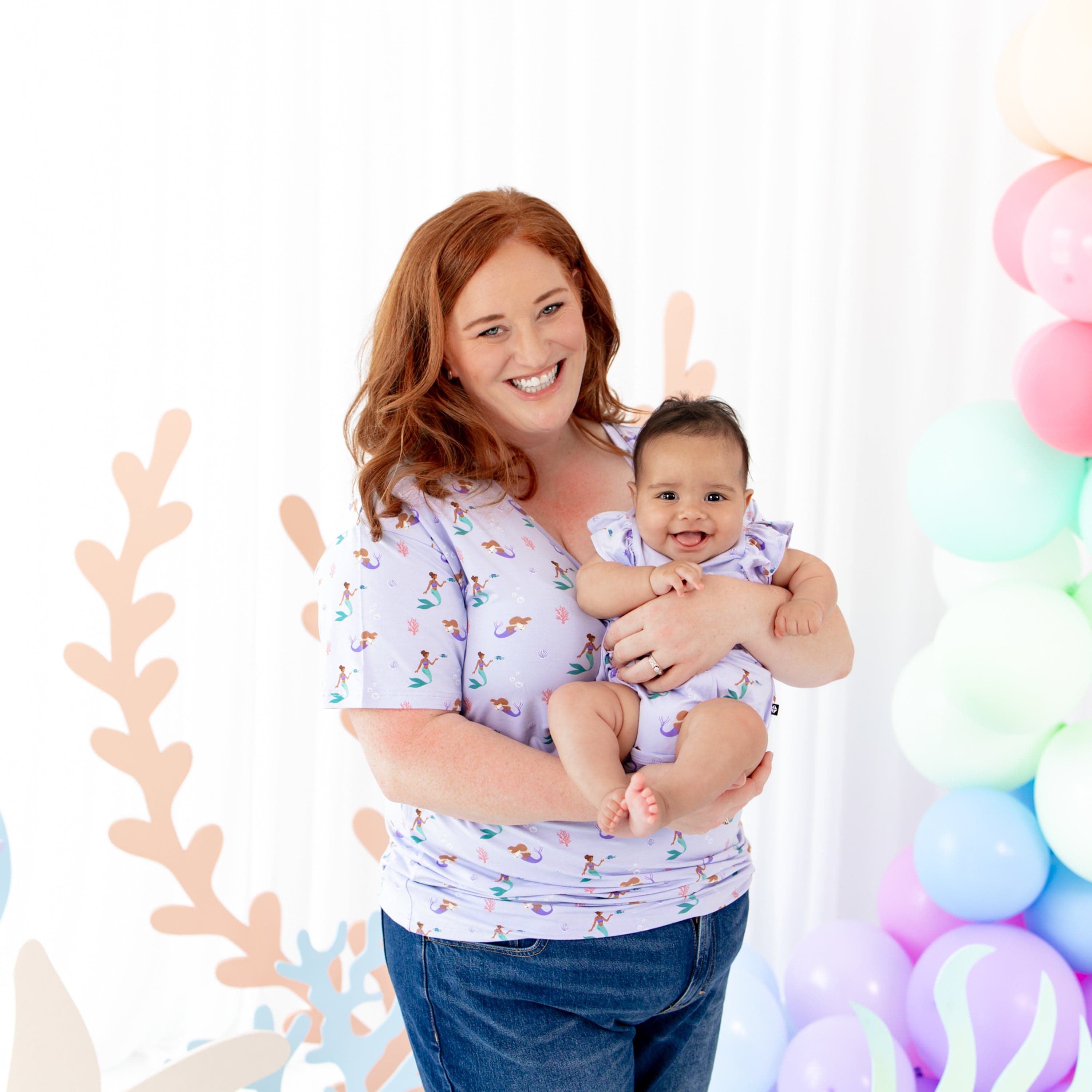 Mom with daughter wearing Kyte Baby bamboo Bubble Romper in Mermaid
