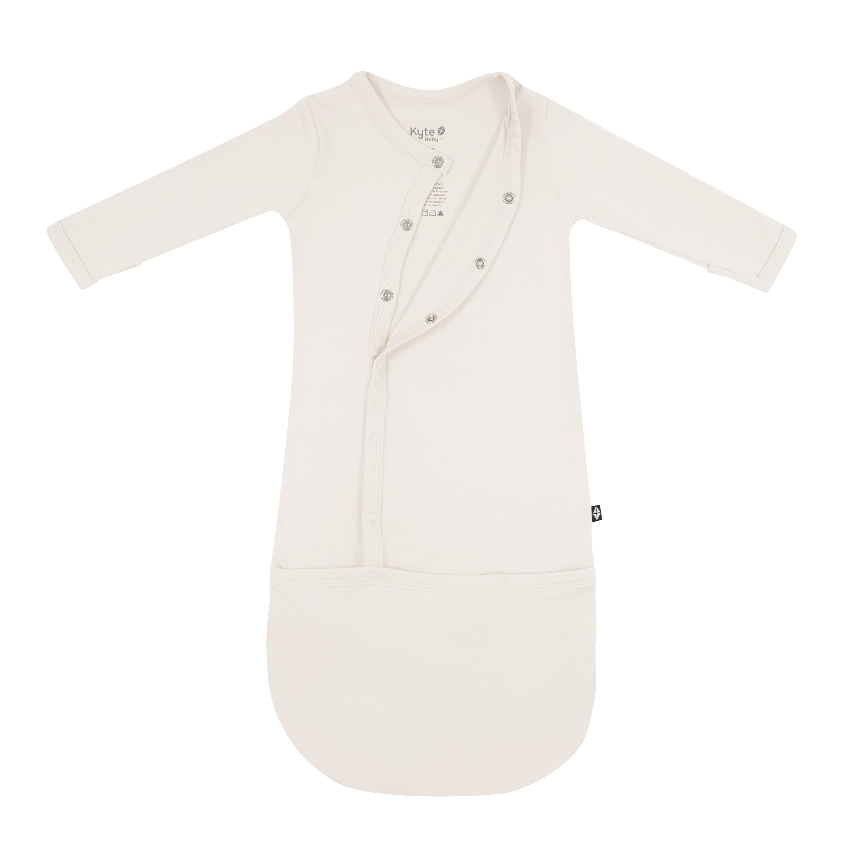 Kyte Baby Snap Bundler in Oat partially unsnapped from the top