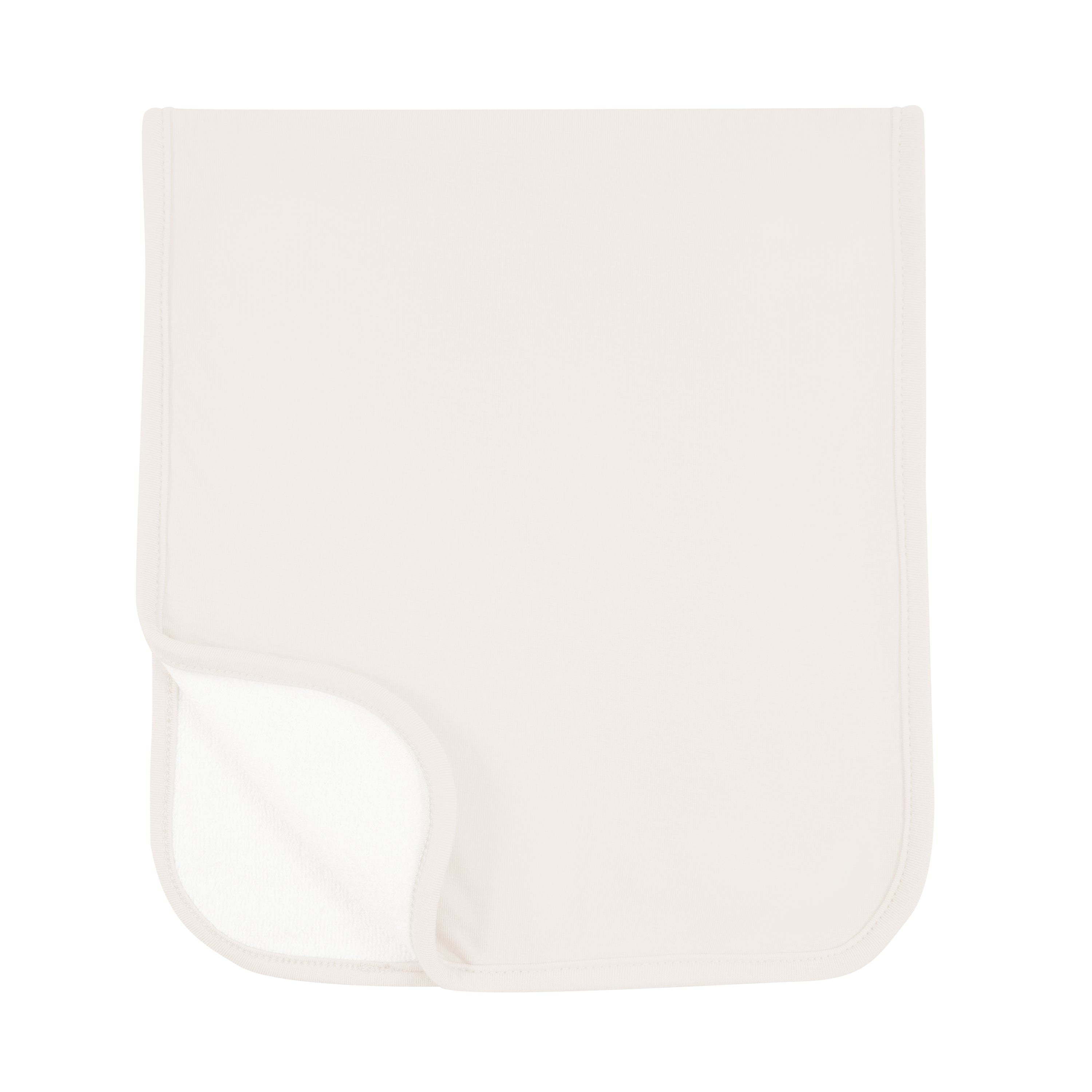 Burp Cloth in Oat folded in half with one corner folded showing terry side
