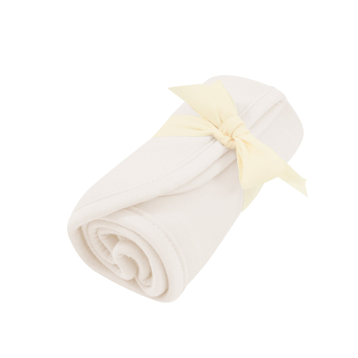 Rolled up Burp Cloth in Oat with bow tied around it