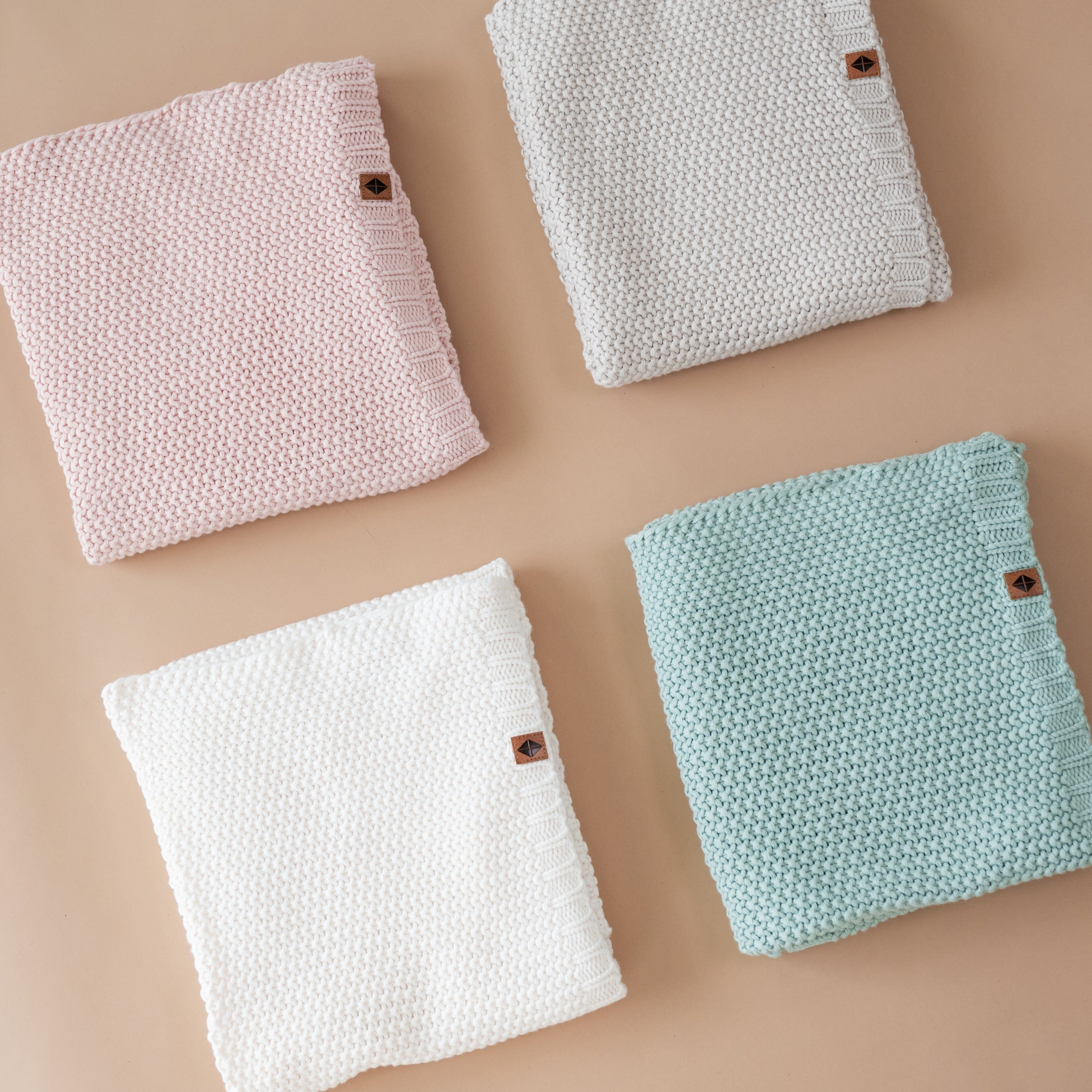 Kyte Baby Chunky Knit Baby Blankets Folded in Core Colors