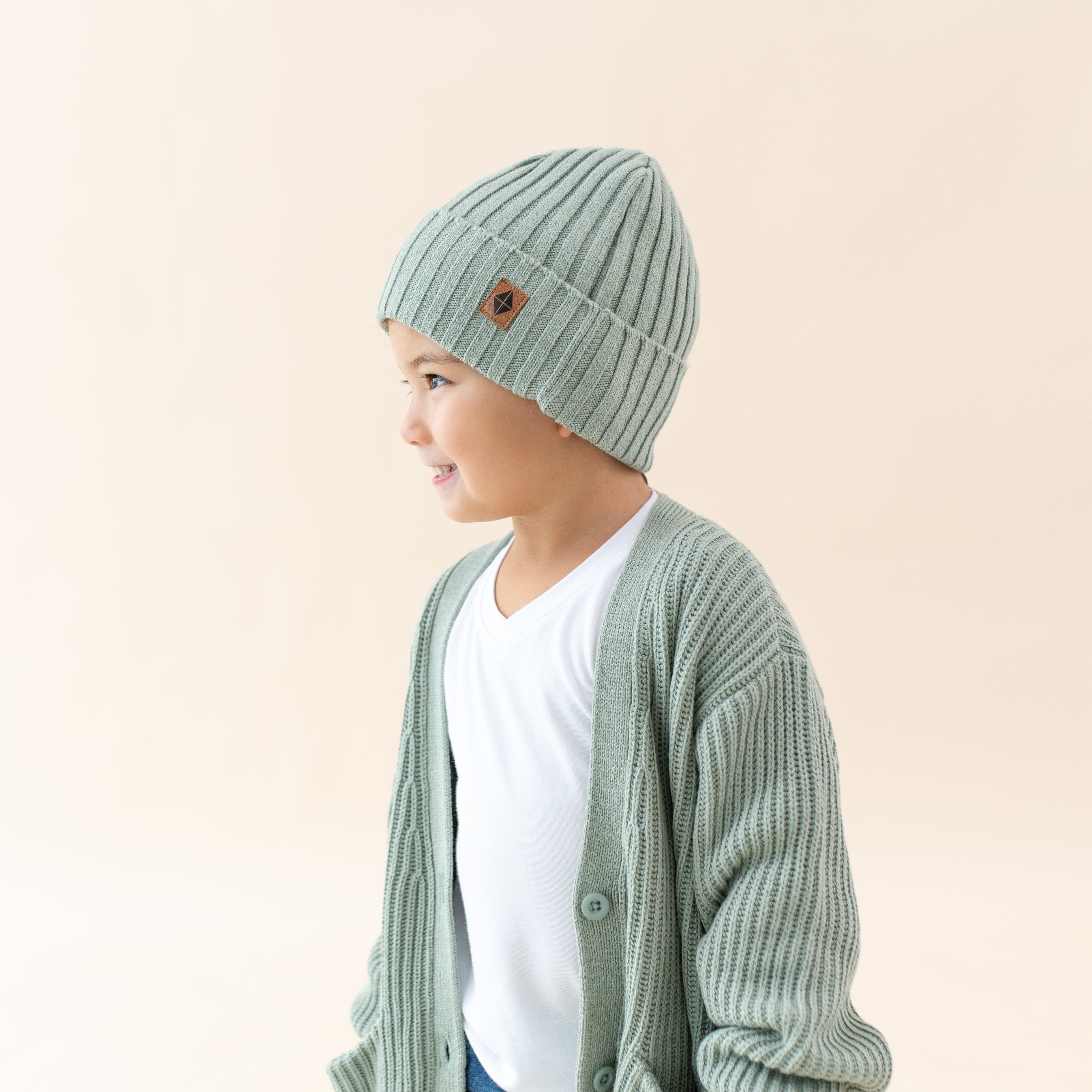 Child wearing Kyte Baby Chunky Knit Ribbed Beanie in Thyme
