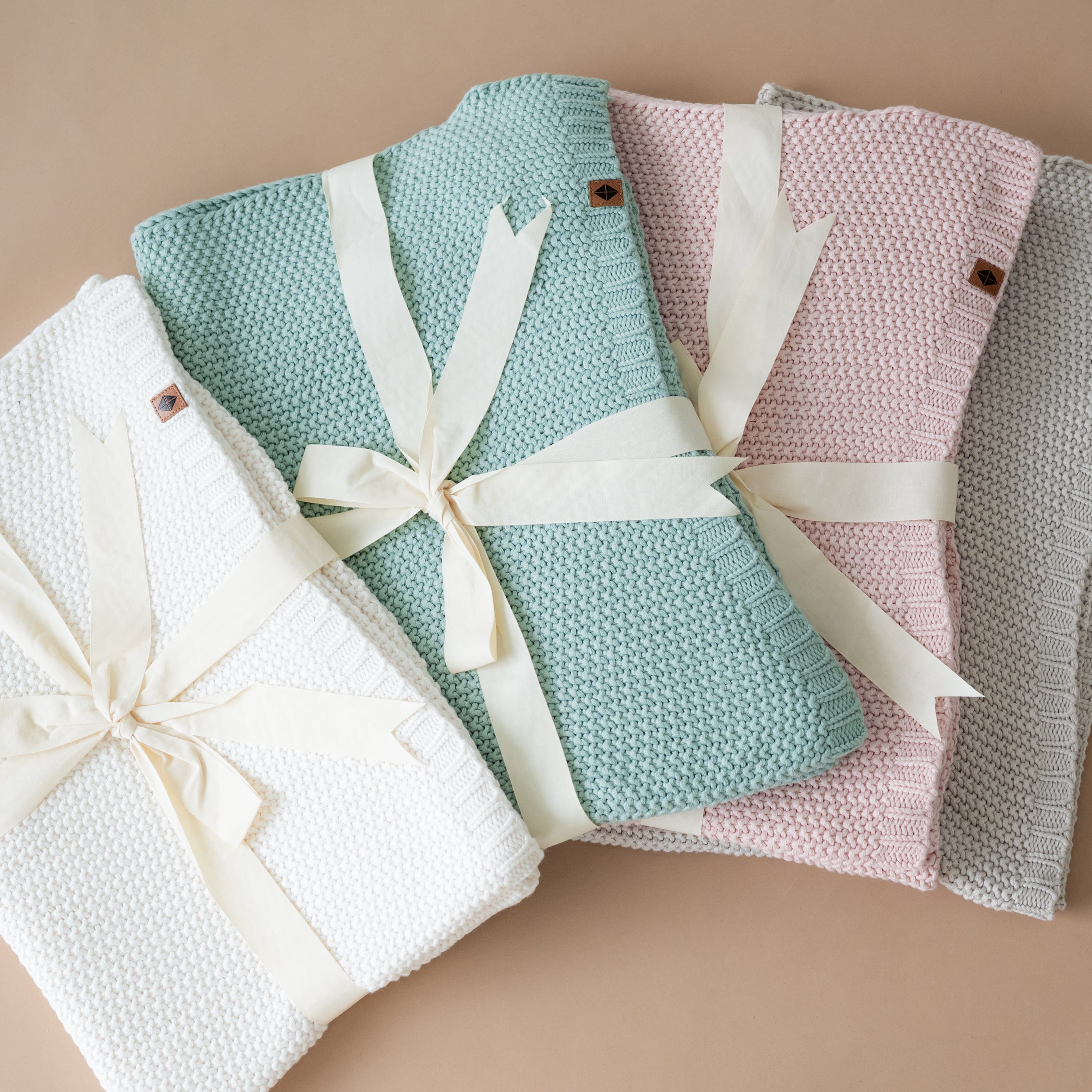 Kyte Baby Chunky Knit Toddler Blankets Folded in Core Colors