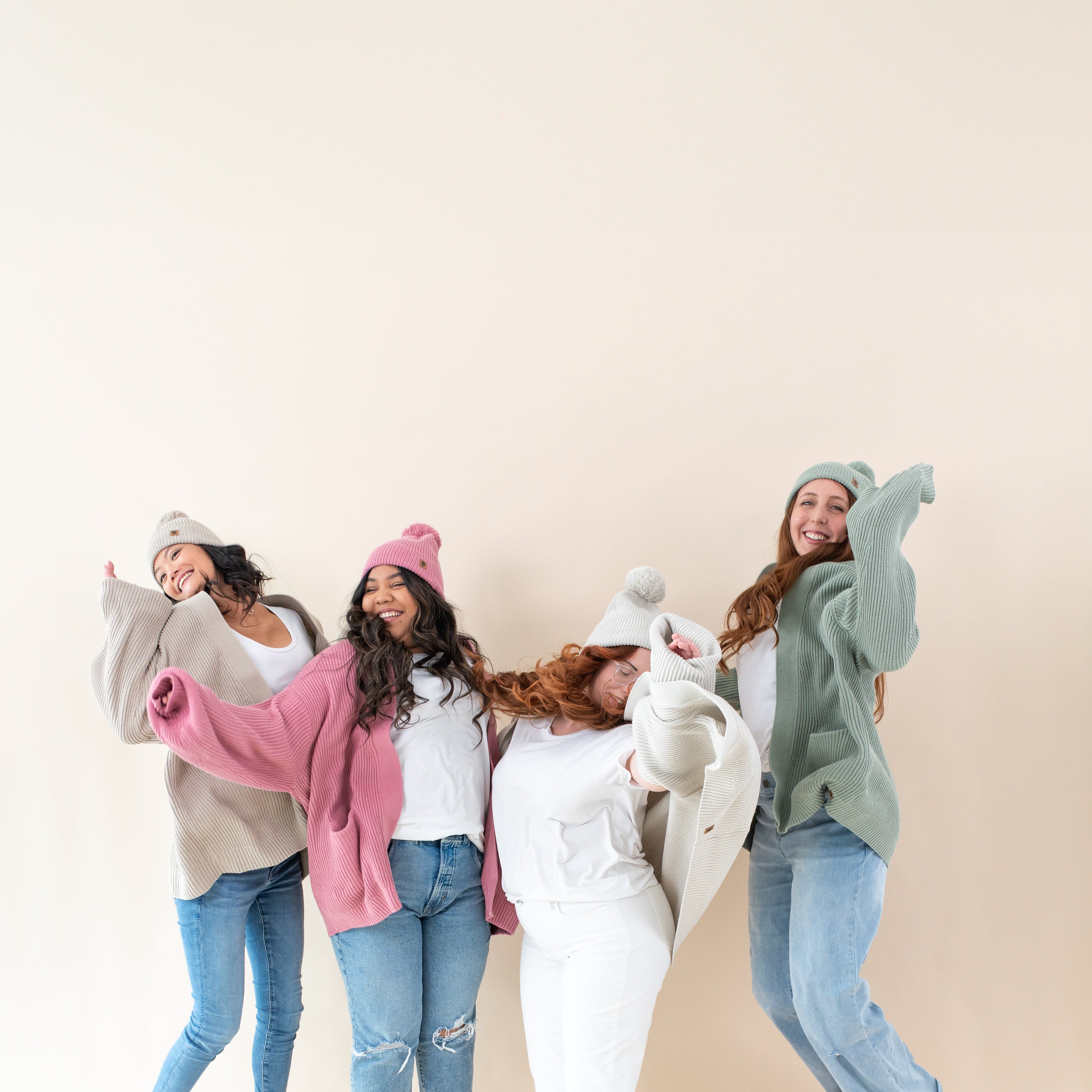 Women wearing Kyte Baby Chunky Oversized Cardigans in core colors