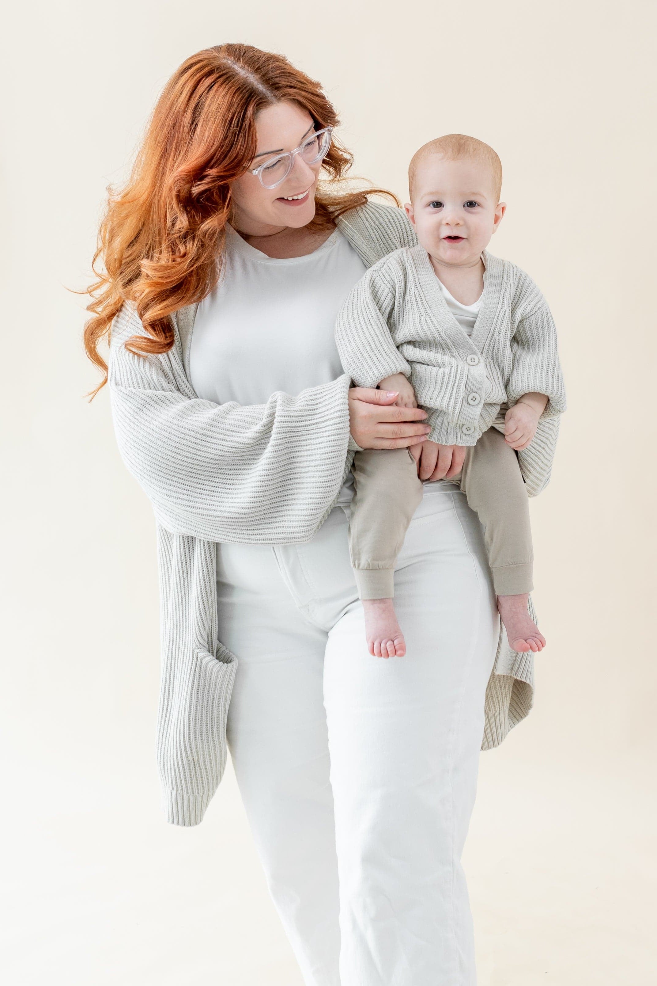 Mom and child wearing matching Kyte Baby Chunky Oversized Cardigans in Oat