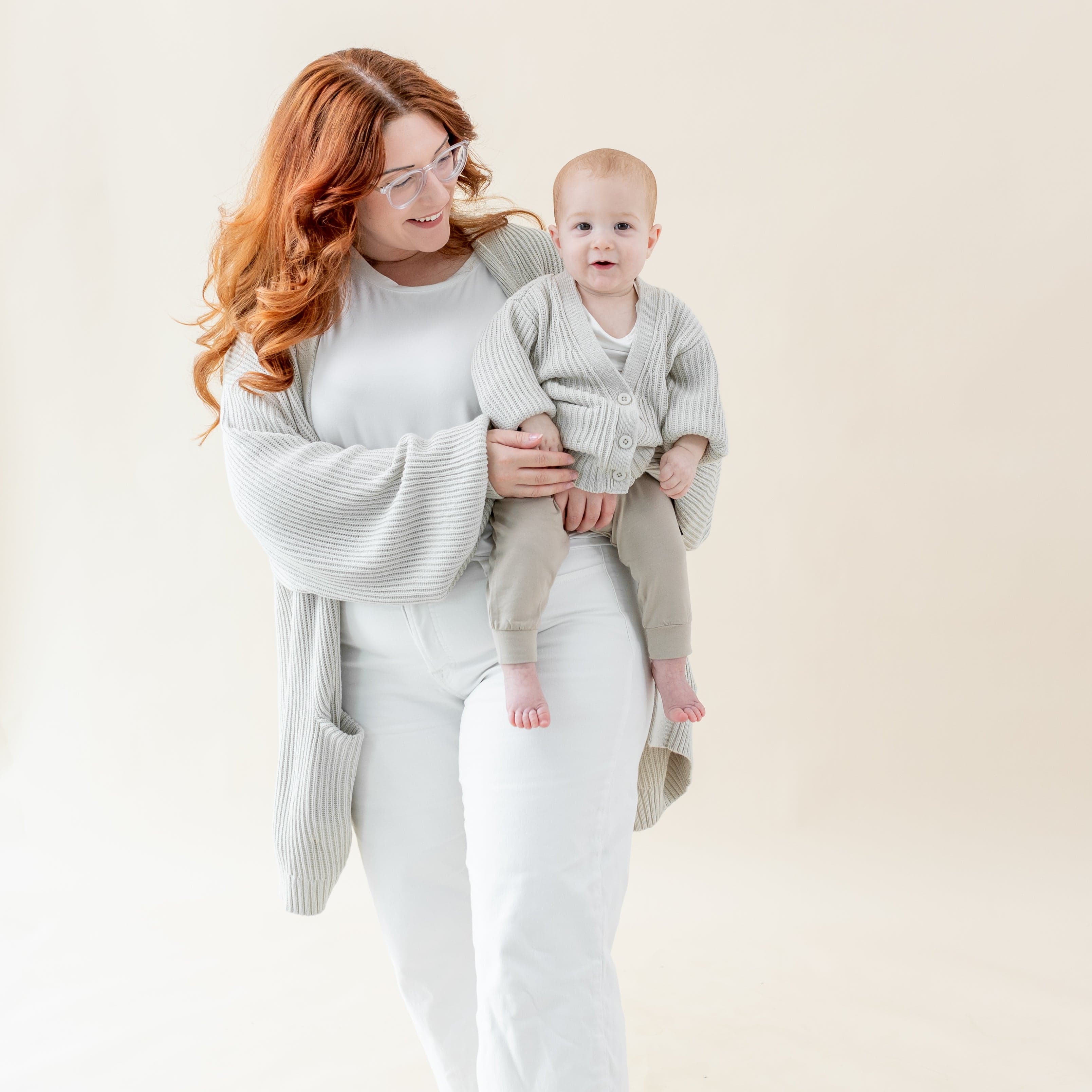 Mom and child wearing matching Kyte Baby Chunky Oversized Cardigans in Oat