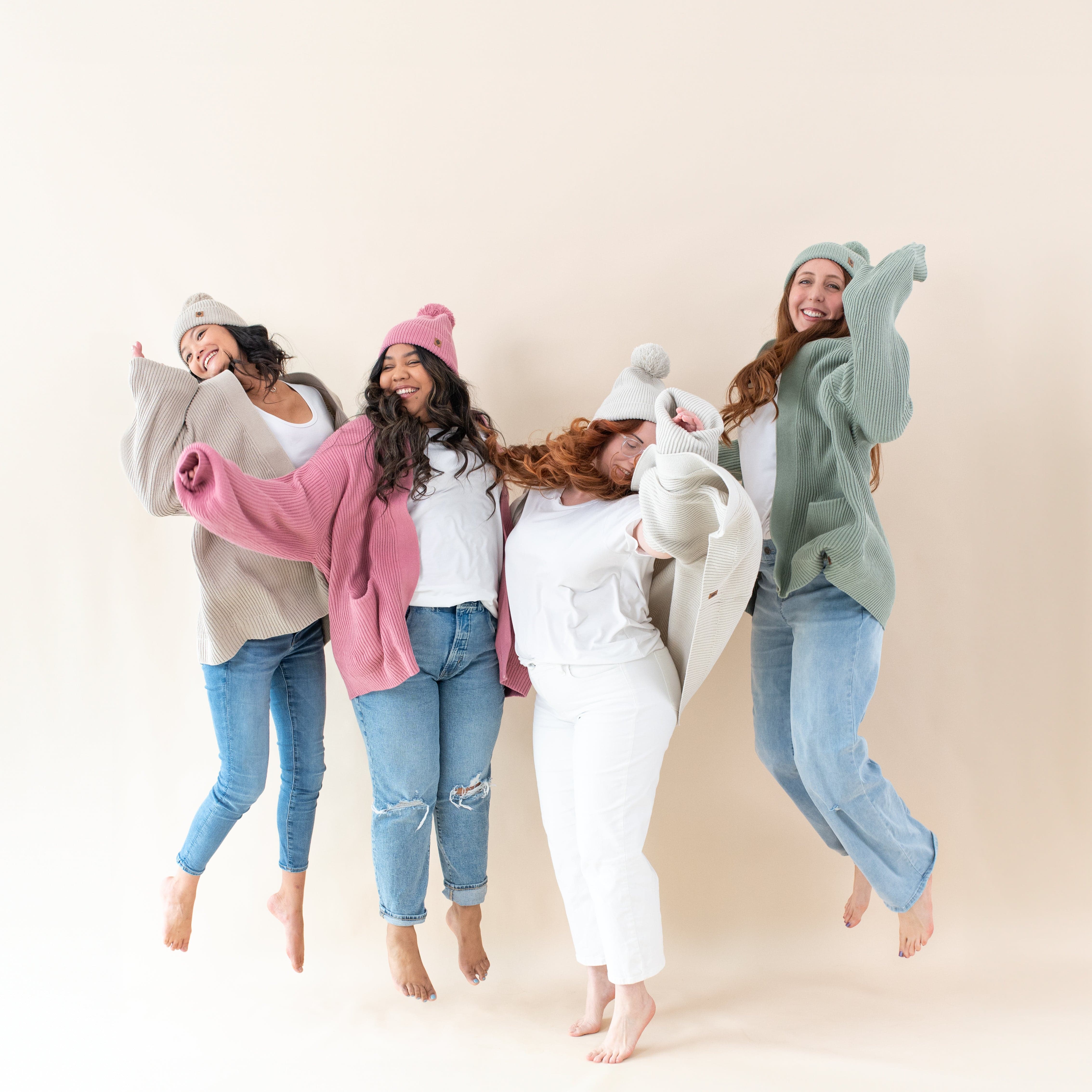 Women wearing Kyte Baby Chunky Oversized Cardigans in core colors