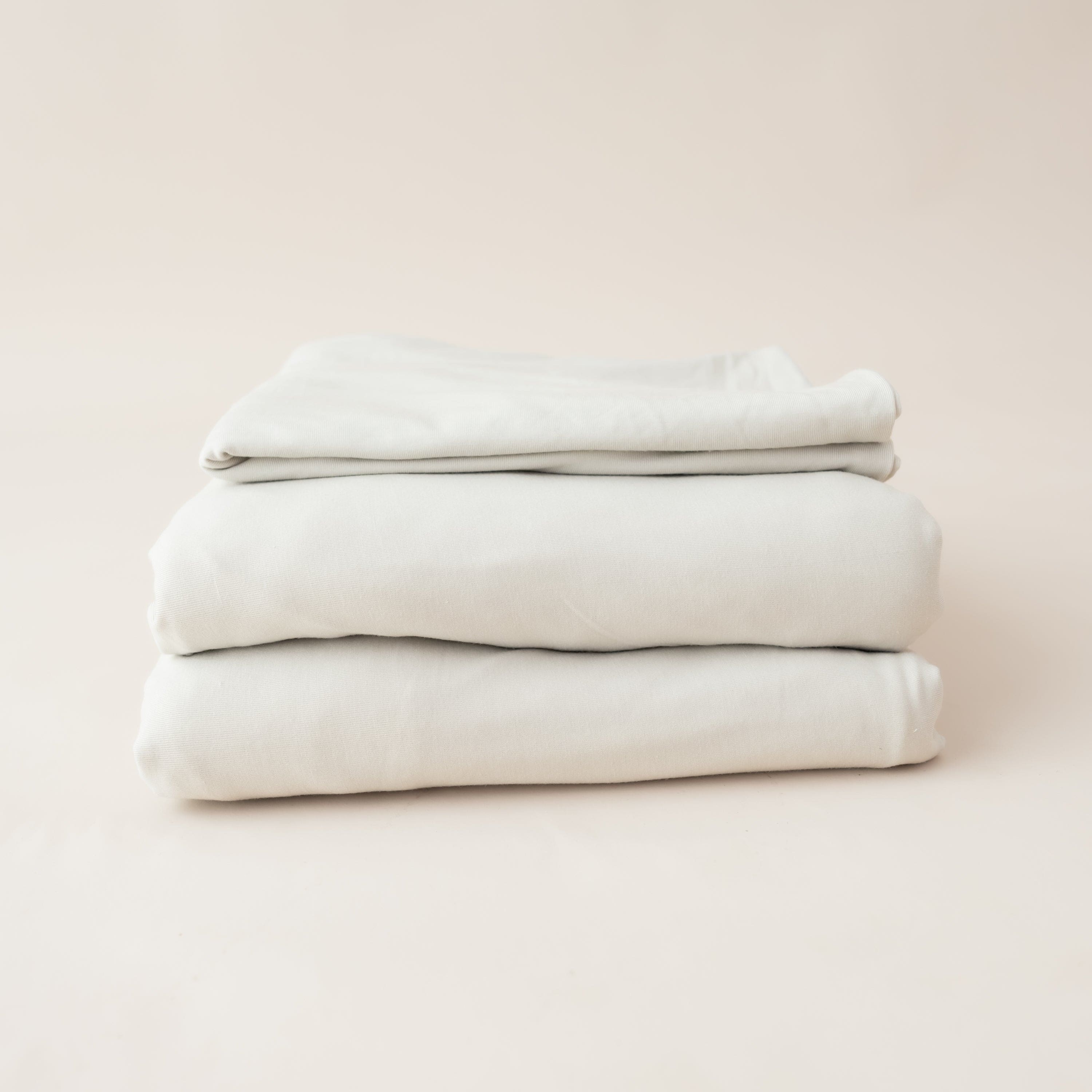 Folded Kyte Baby Fitted Sheet with Pillowcases in Oat