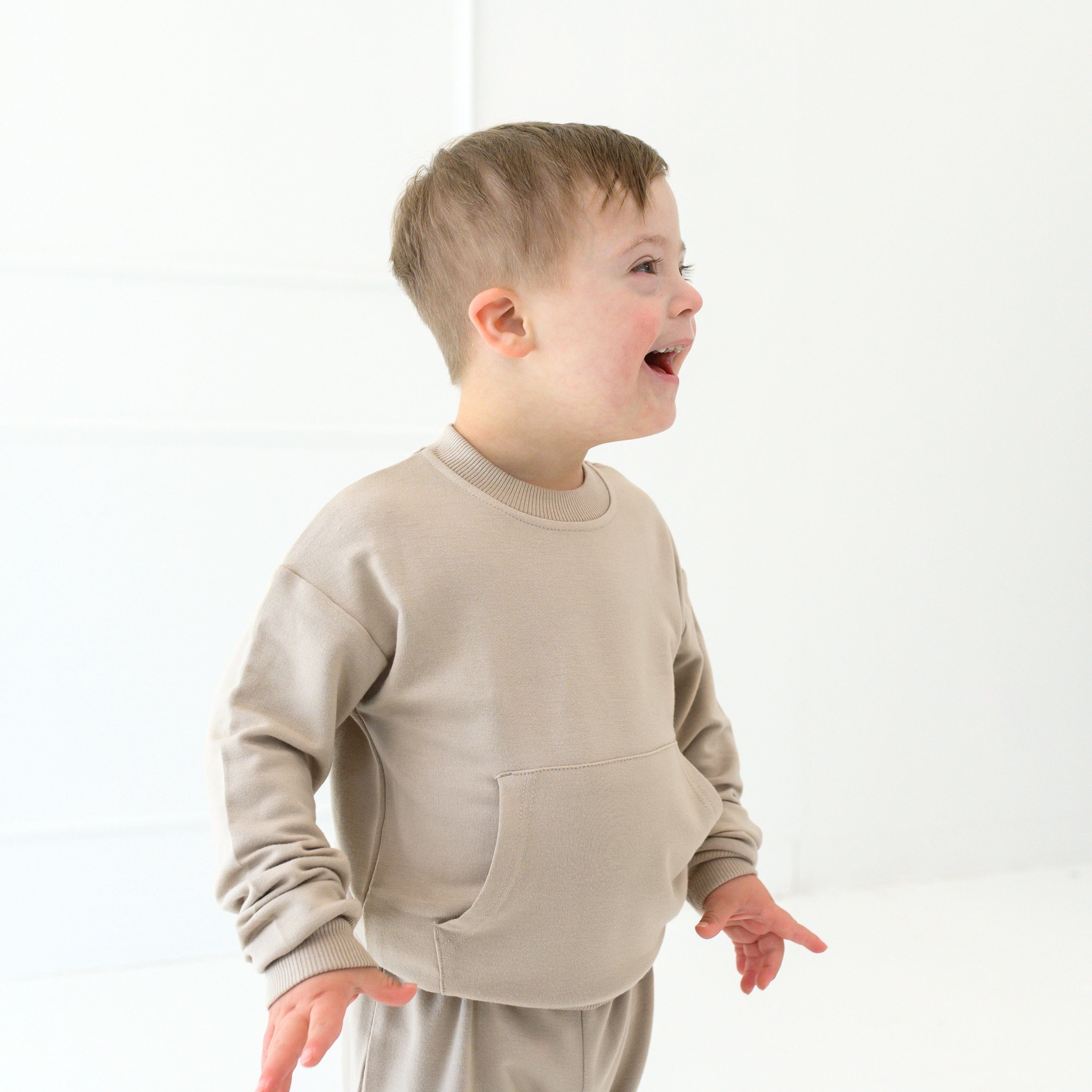 Toddler wearing Kyte Baby French Terry Jogger Set in Almond